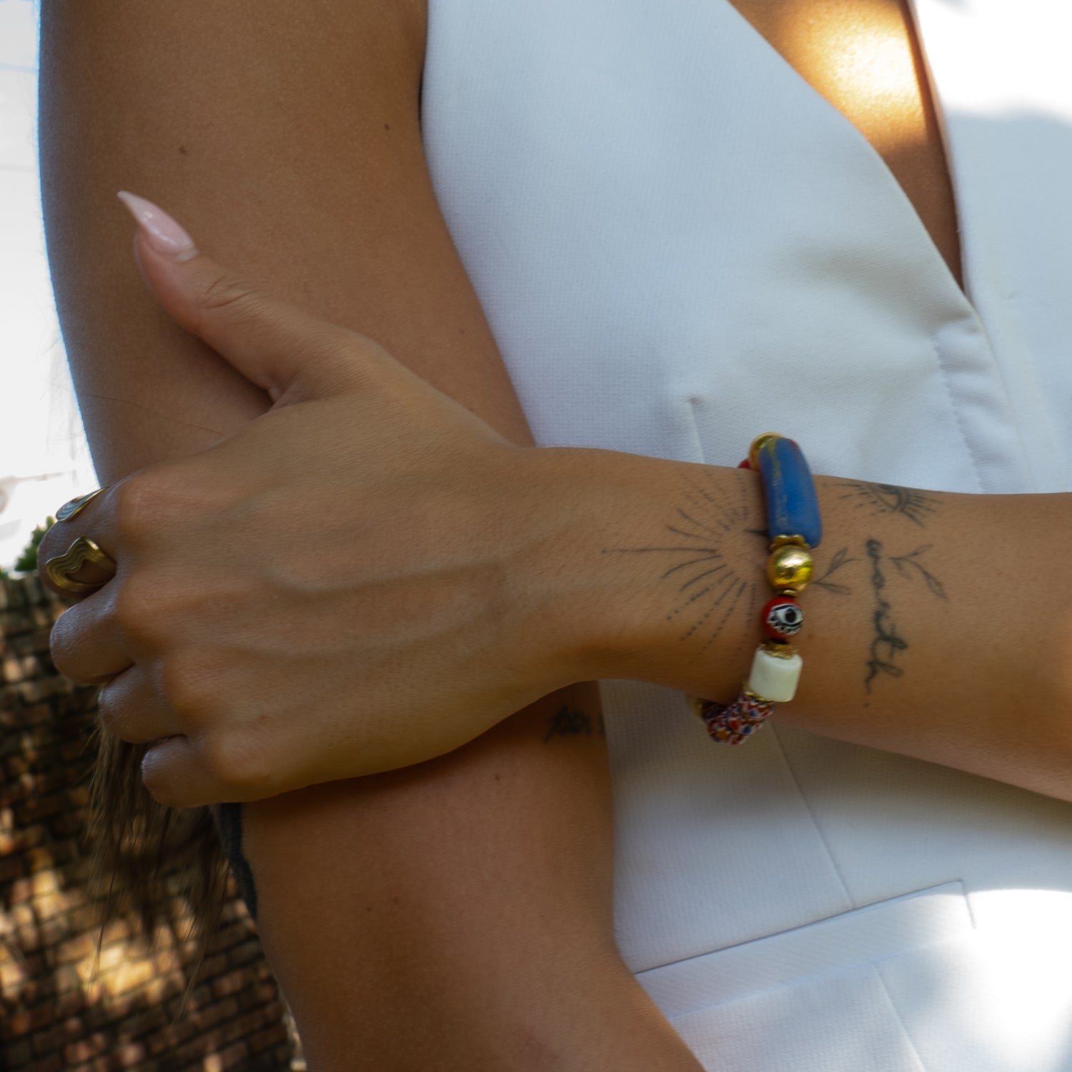 Close view of vintage African trade bead and evil eye stretch bracelet