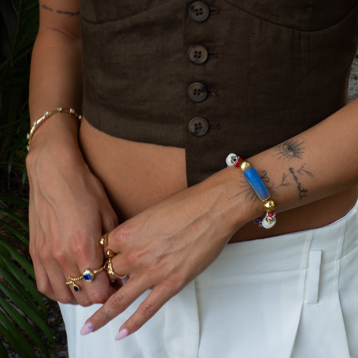 Sacred African chevron bead evil eye stretch bracelet styled outdoors