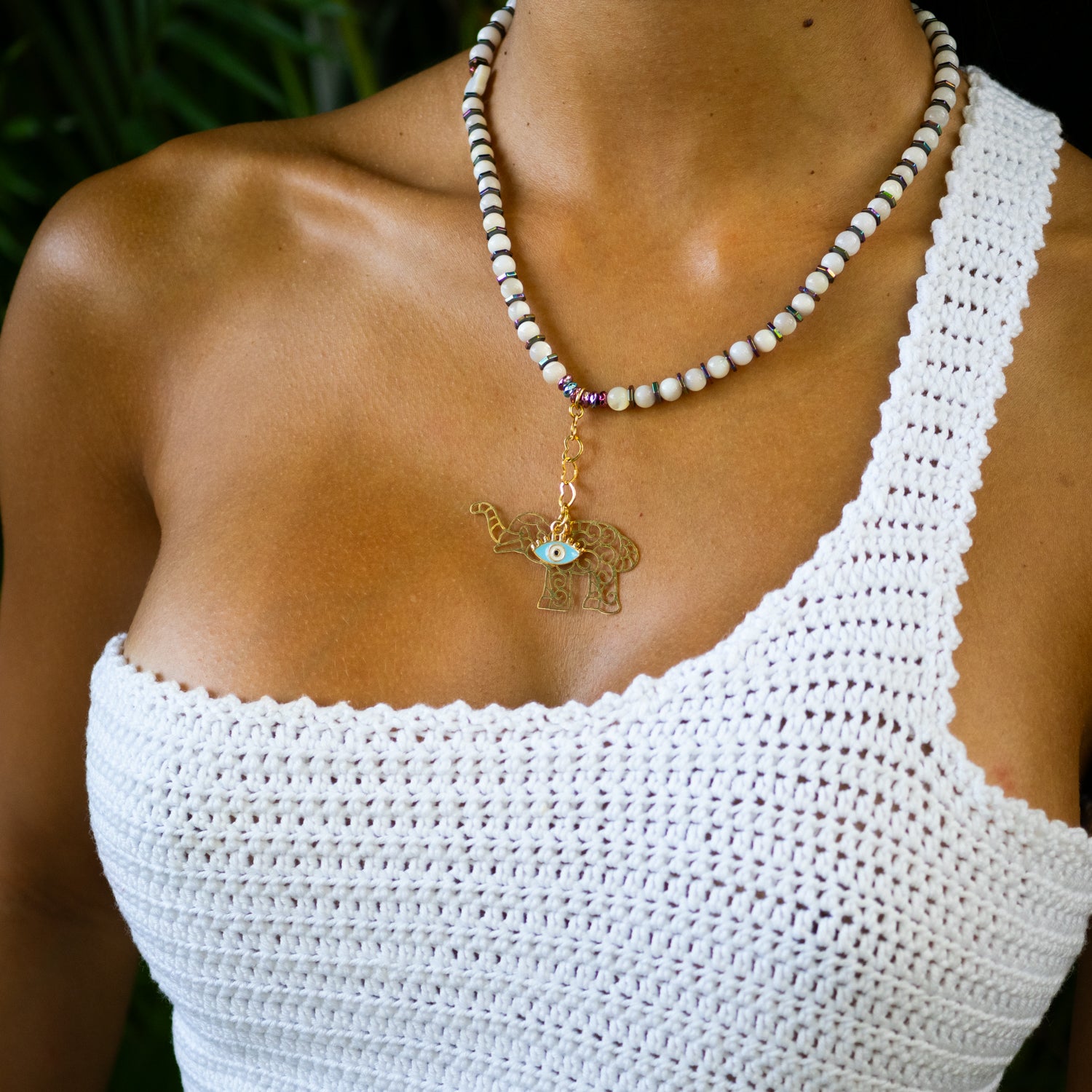 Pearl necklace with colorful hematite beads and gold-plated elephant evil eye charm for protection and luck