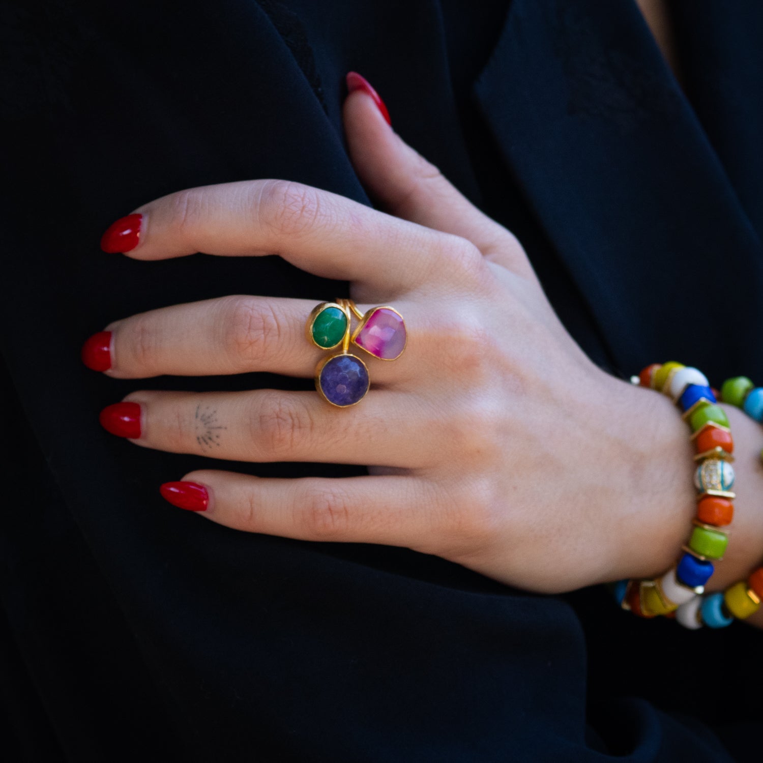 Handmade spiritual ring featuring soft pink quartz, deep emerald, and mystical amethyst

