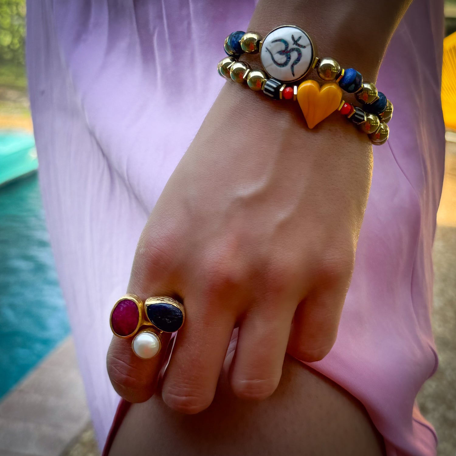 Handcrafted gold ring featuring natural pearl, vibrant ruby, and deep amethyst for daily energy

