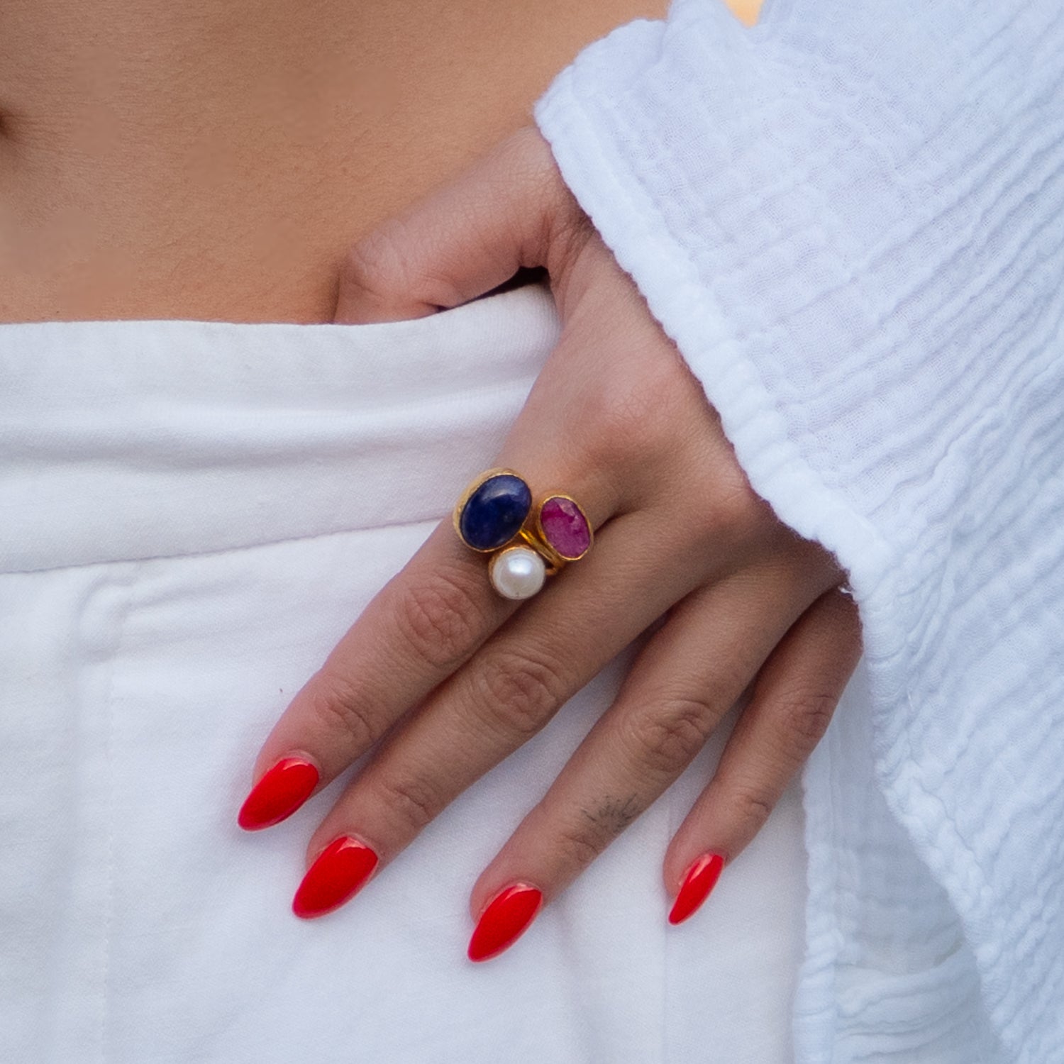 Handmade spiritual ring featuring natural pearl, ruby, and amethyst stones in gold-plated setting

