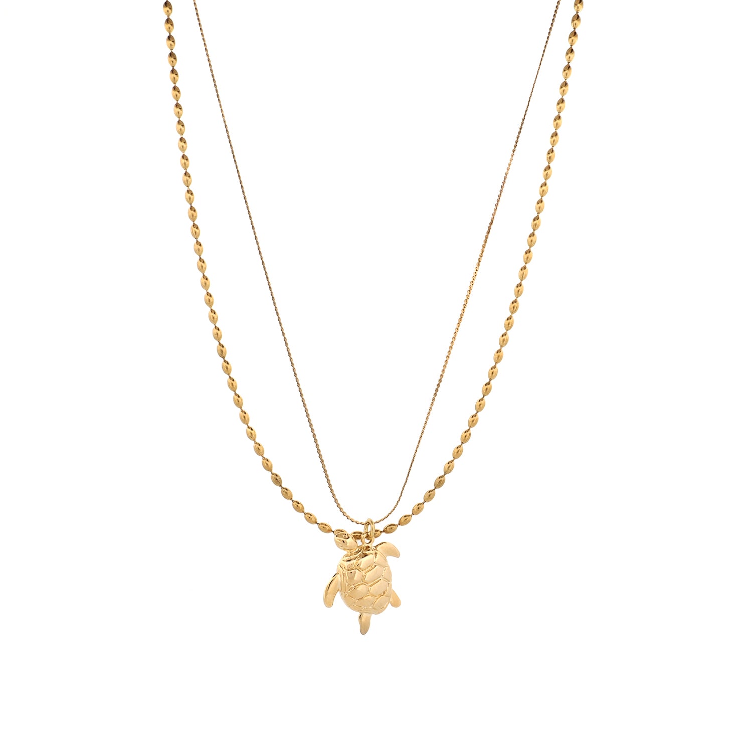 Gold sea turtle pendant on a delicate layered double chain necklace