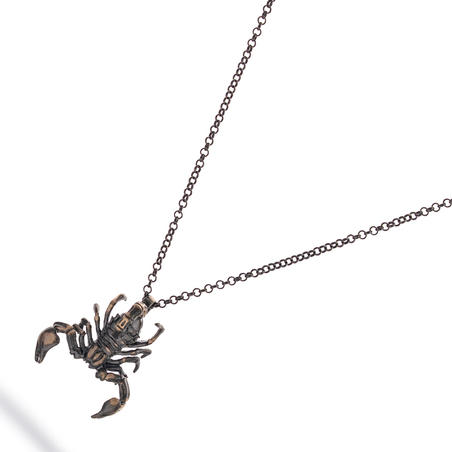 Sterling silver men’s necklace with an intricately detailed scorpion pendant, rhodium finish, bold and modern jewelry style.