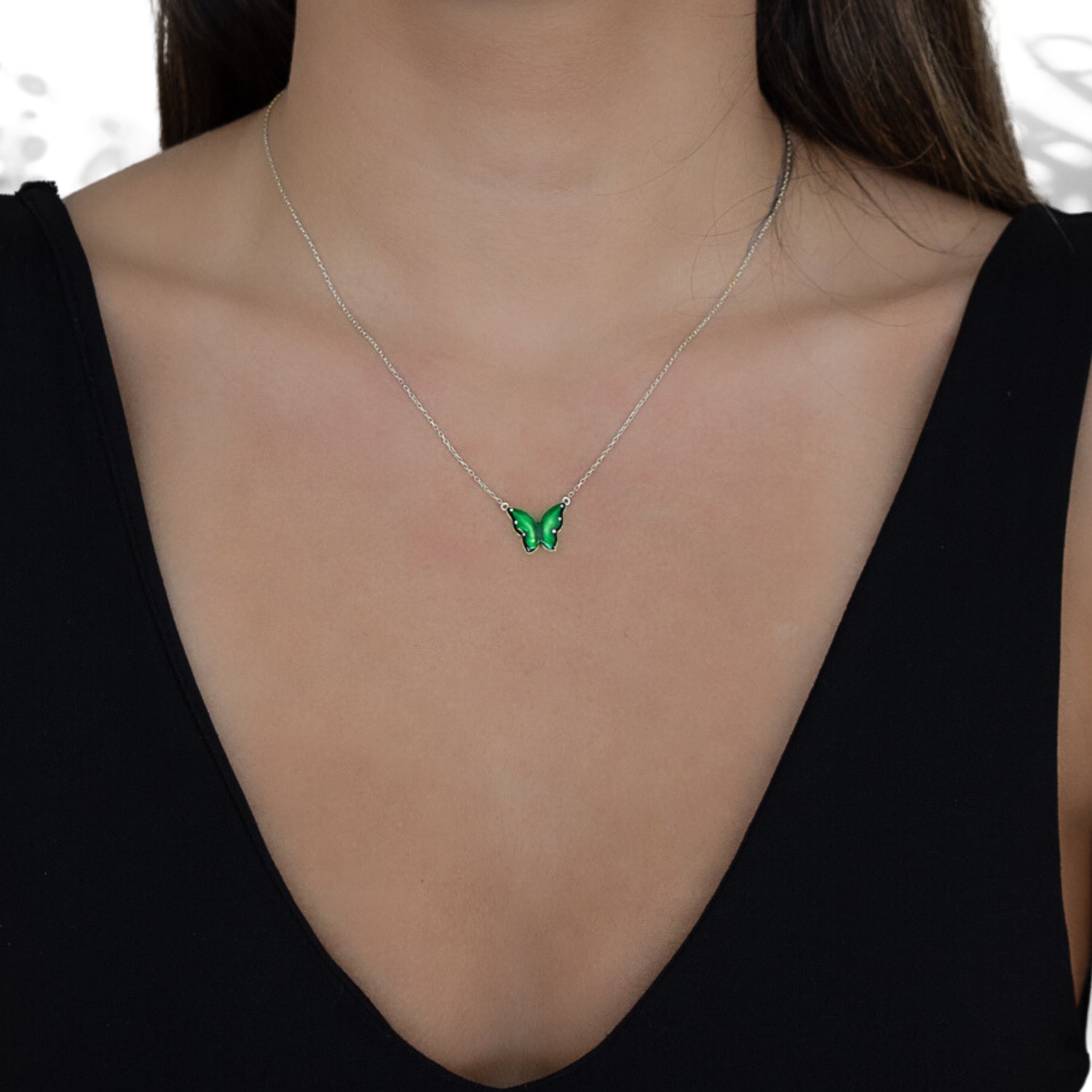 A model wearing the Silver Abundance Green Enamel Butterfly Necklace, radiating spirituality and inner growth.