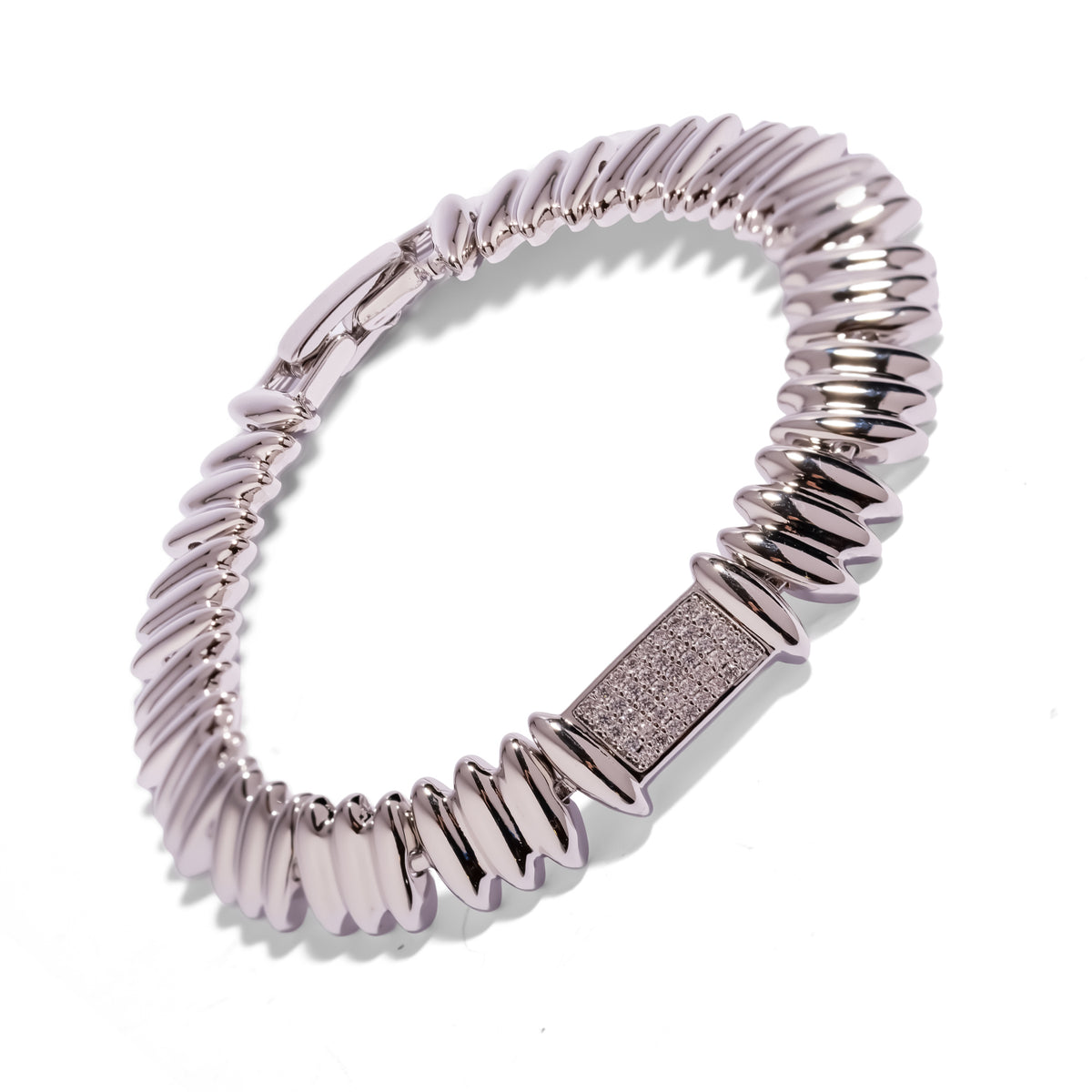 Silver Rhythm Pave Zircon Sculptural Link Bracelet tilted on white, pave zircon station and clasp in view