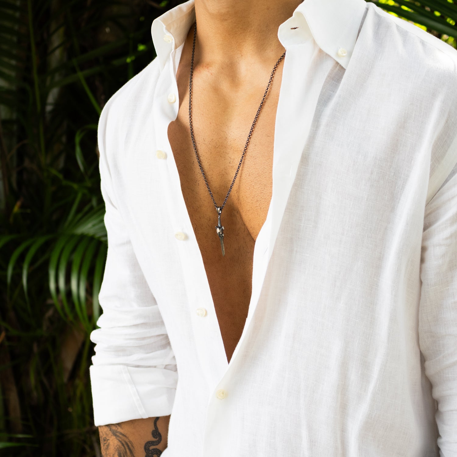 Sterling silver necklace with skull and sword blade pendant, rhodium plated, oxidized finish, 27-inch chain, warrior men’s jewelry.