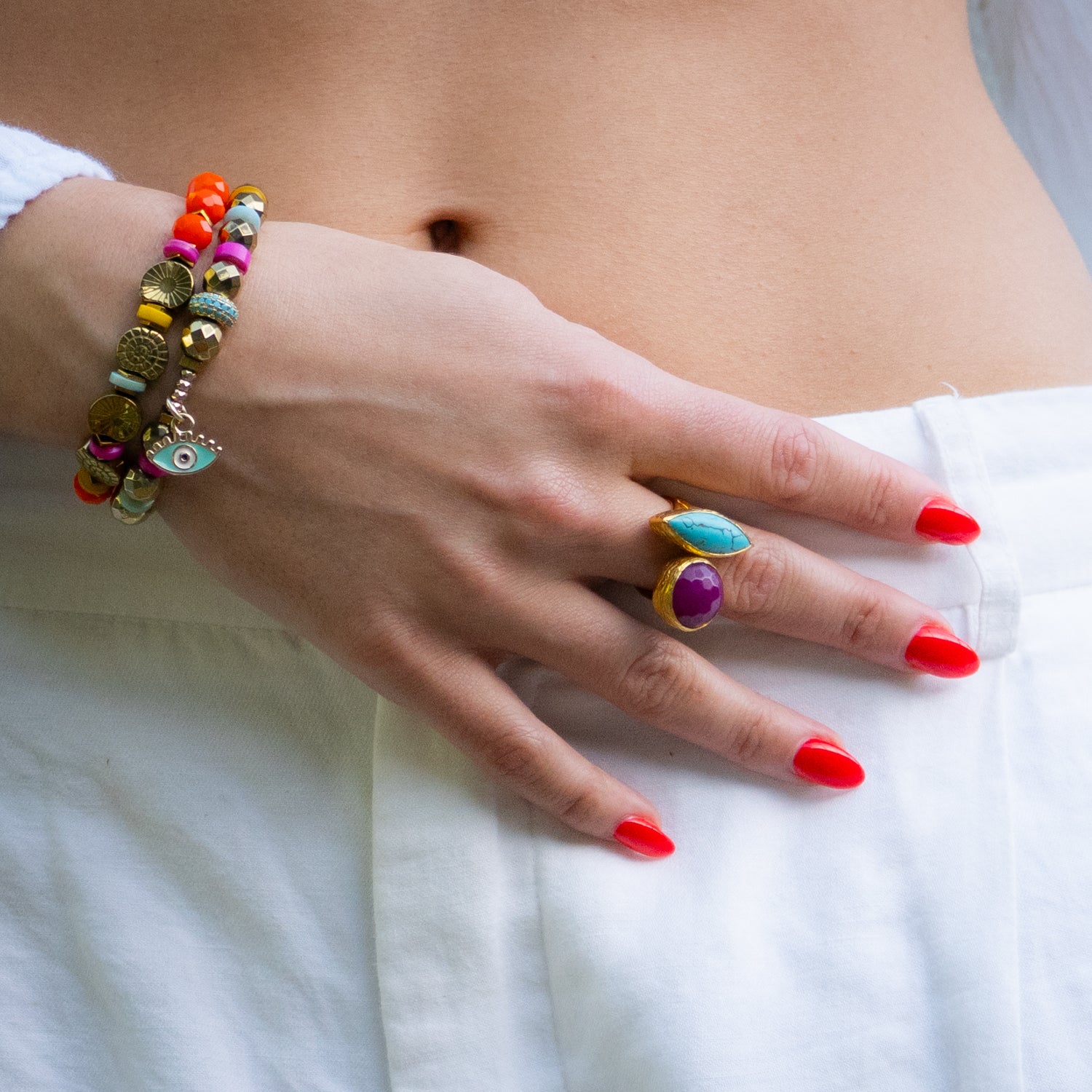 Handmade statement ring featuring marquise-cut turquoise and round ruby stones


