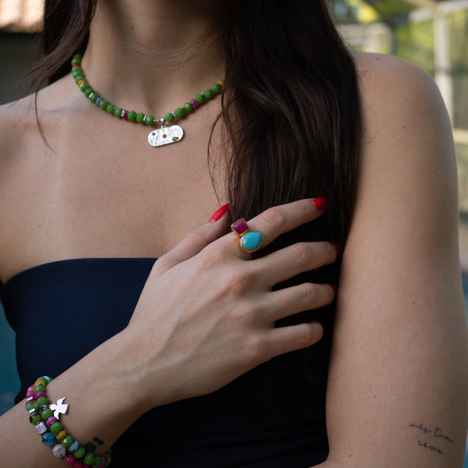 Bold artisan ring combining calming turquoise and vibrant ruby for spiritual harmony

