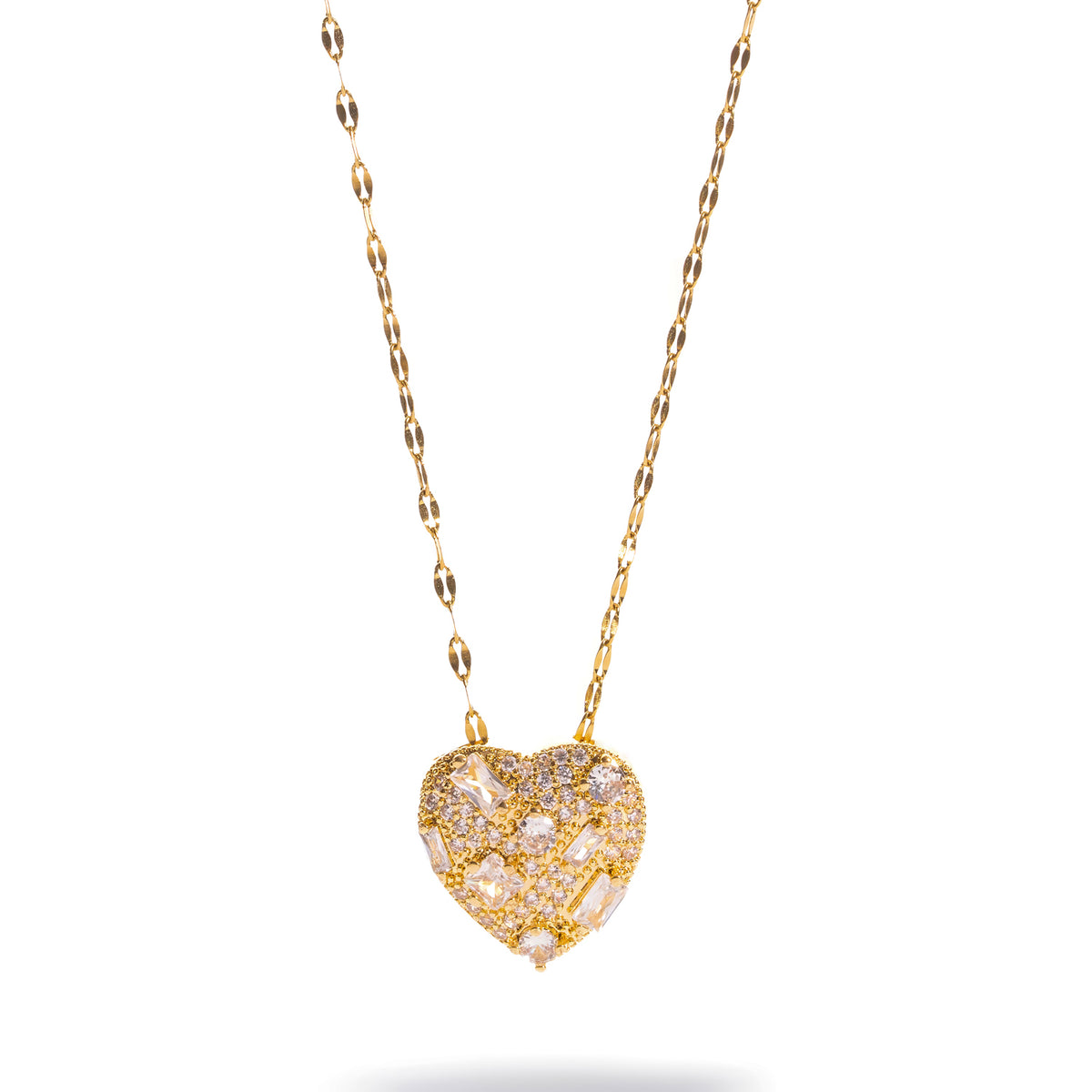 Big heart gold statement necklace on a fine shimmer chain against a white background