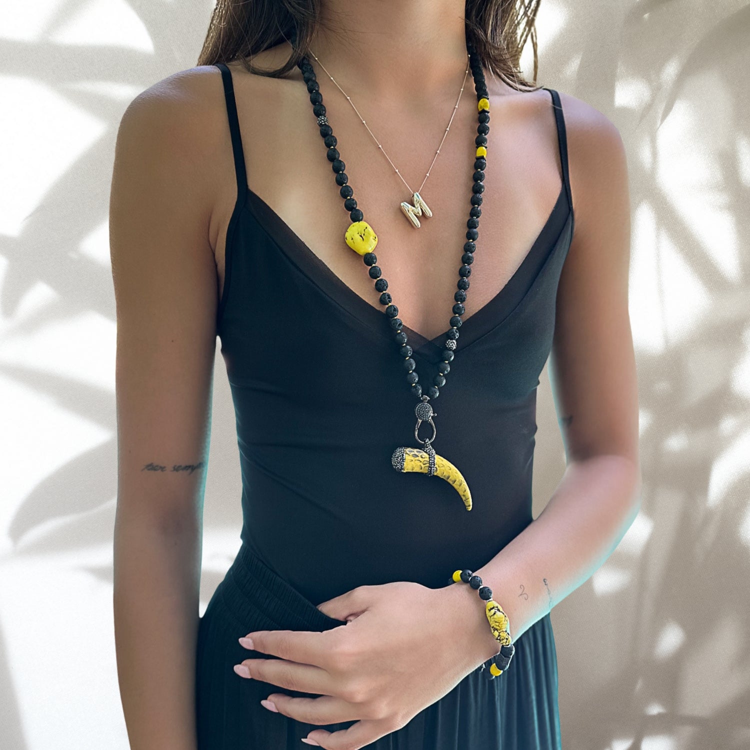 Model wearing the Spirit Cornicello Unique Necklace, exuding confidence and embracing the symbolic power of the pendant.