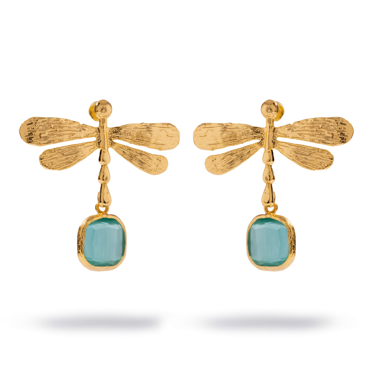 Pair of Spiritual Dragonfly gold drop earrings on white, veined gold wings above a cushion cut aqua blue cat's eye stone