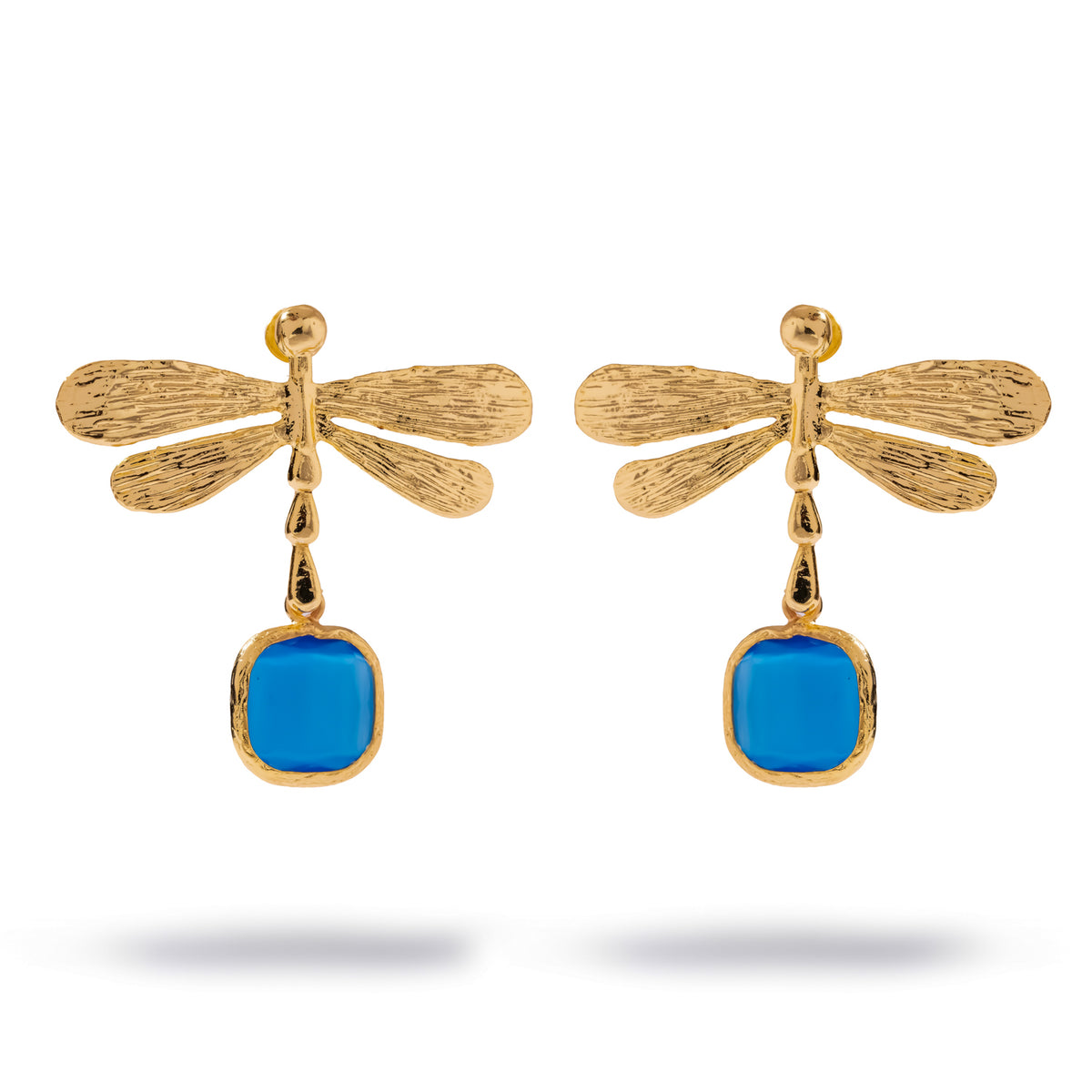 Pair of Spiritual Dragonfly gold drop earrings on white, veined gold wings above a cushion cut deep blue cat's eye stone