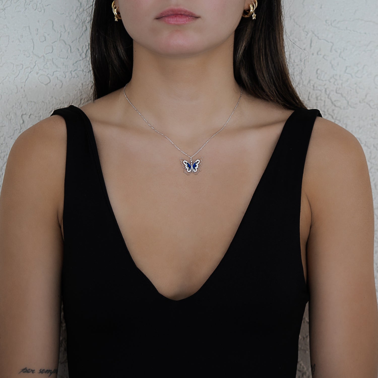 Model wearing the Spiritual Transformation Blue Butterfly Necklace, embracing their journey of transformation and radiating confidence and inner beauty.