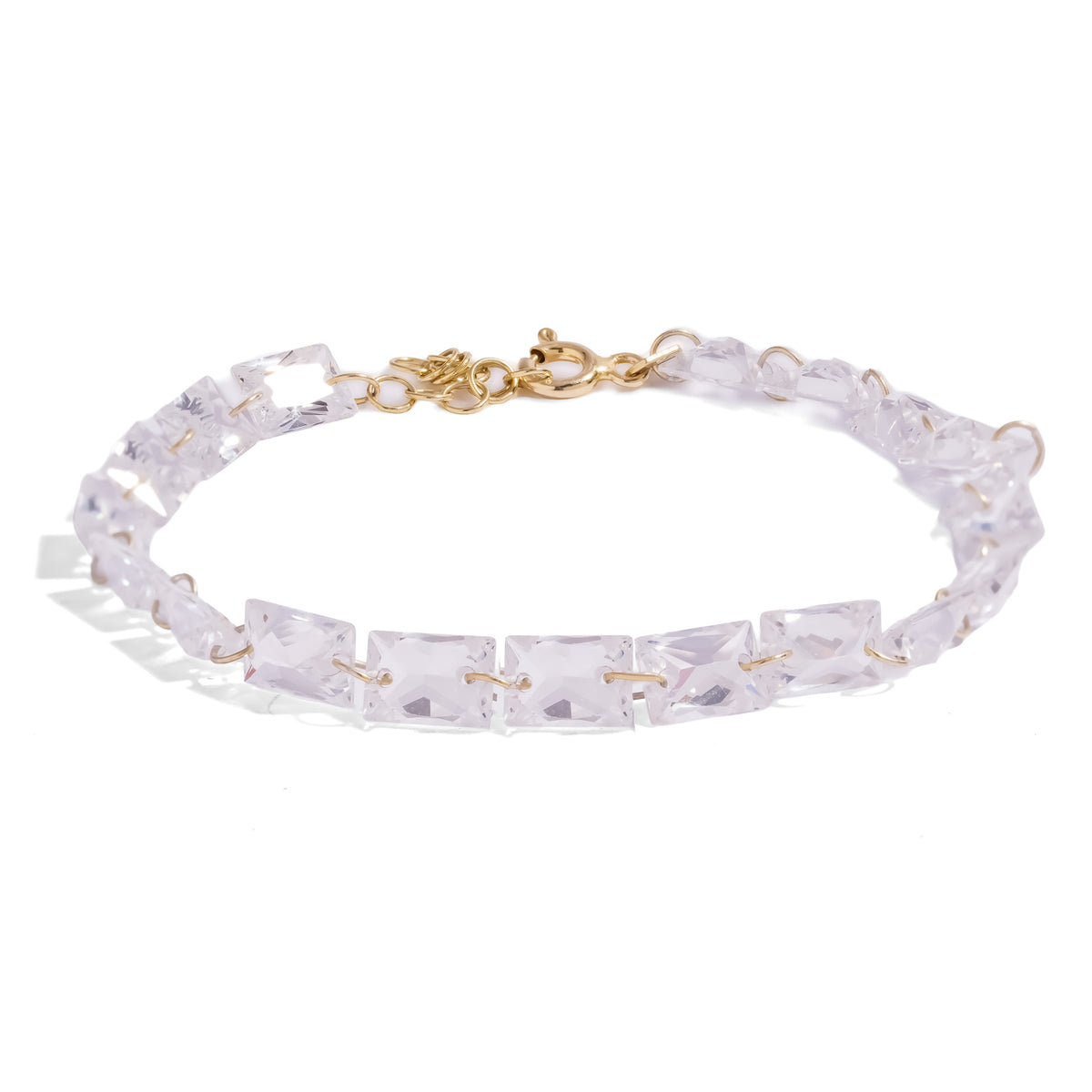 Starlight Emerald Cut Zircon Gold Tennis Bracelet, a row of large rectangular clear zircons joined by fine gold wire