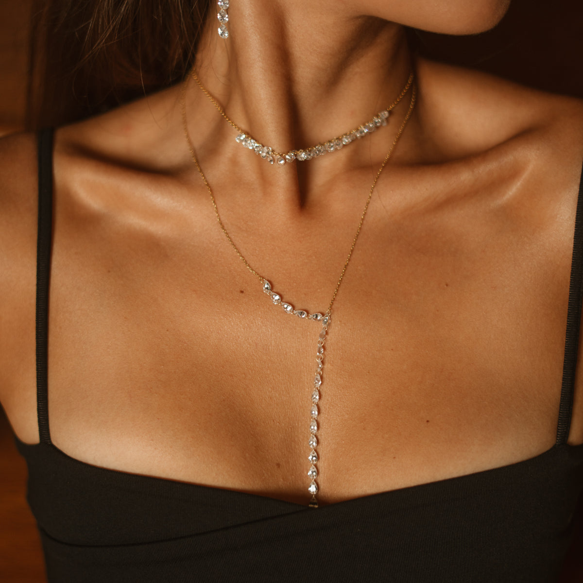 Close up of the Starlight Glow Pave Zircon Gold Choker Necklace at the base of the neck