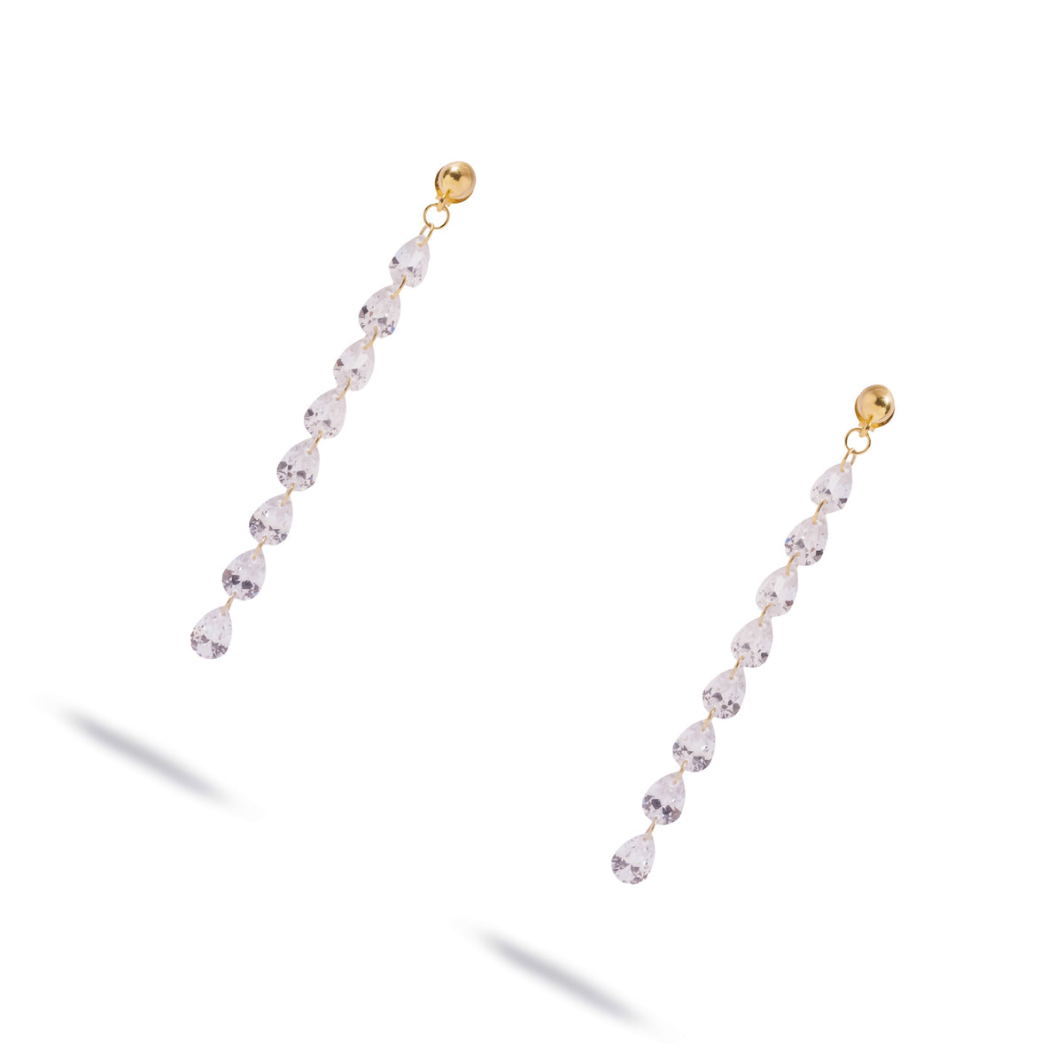 Angled view of the Starlight pear cut zircon earrings on white