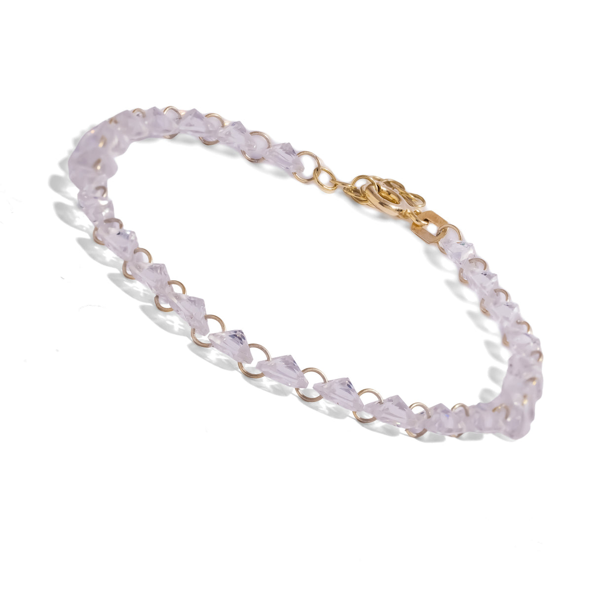 Angled view of the Starlight trillion cut zircon tennis bracelet on white