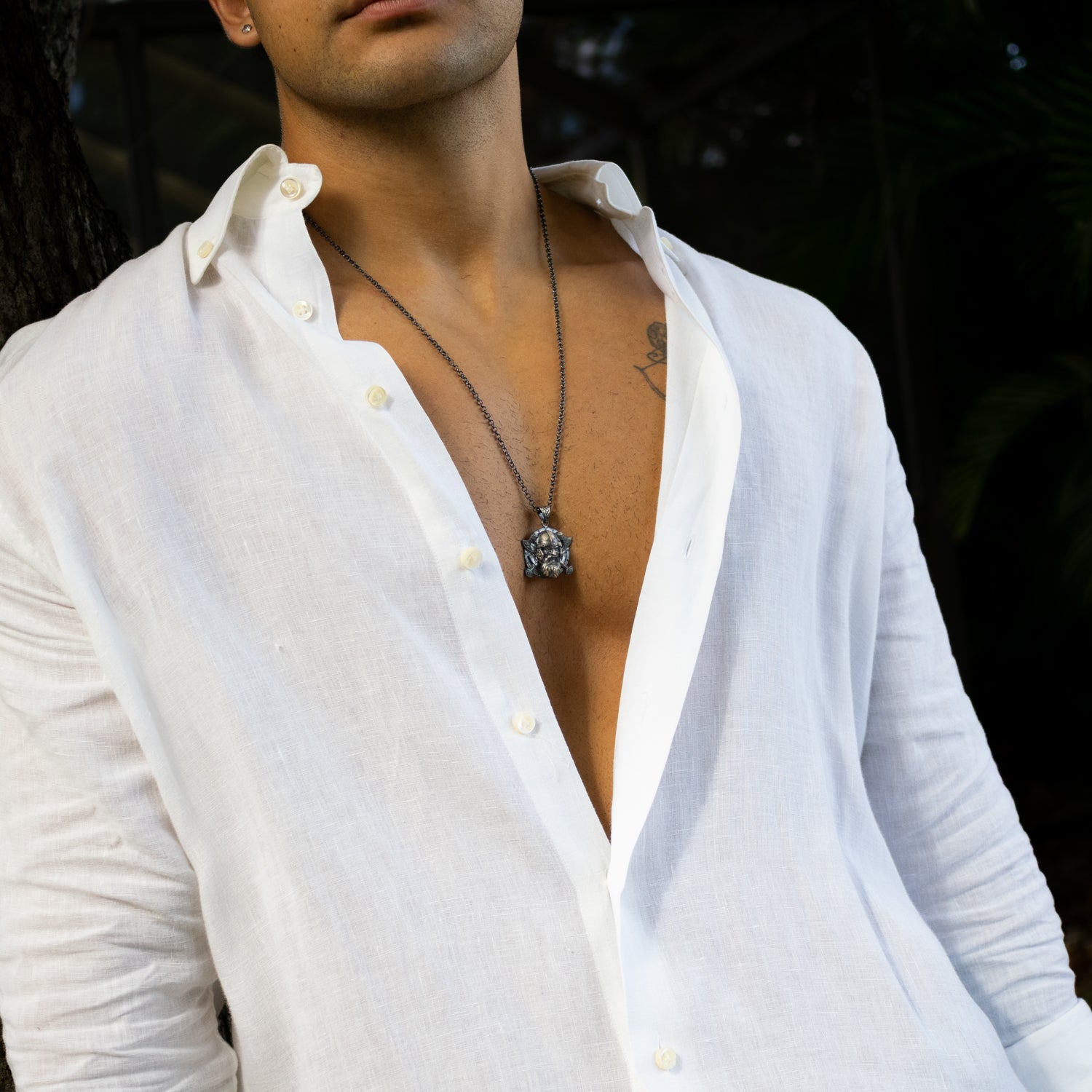 Sterling silver necklace with Viking warrior medallion pendant, rhodium-plated finish, intricate detailing, black accents, bold masculine style.