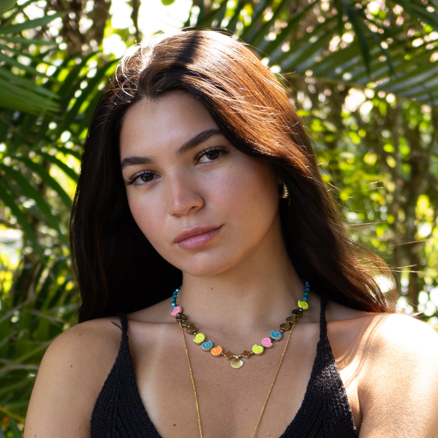 Handmade summer necklace featuring enamel shell beads and 18K gold-plated seashell centerpiece

