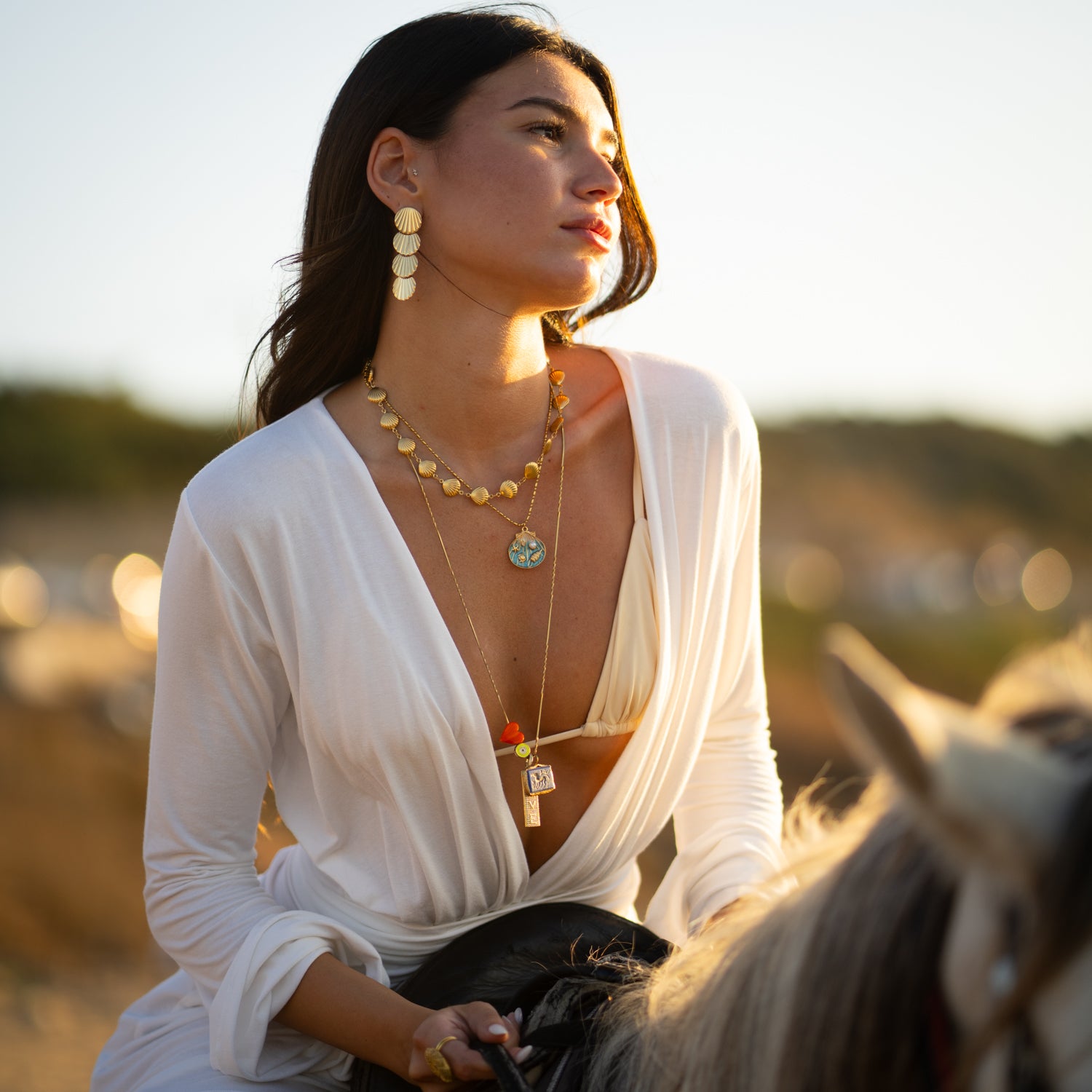 Lightweight water-resistant gold seashell earrings for seaside vacation looks
