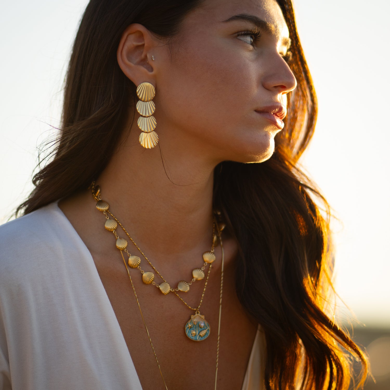 Summer jewelry with gold seashell charm on stainless steel chain