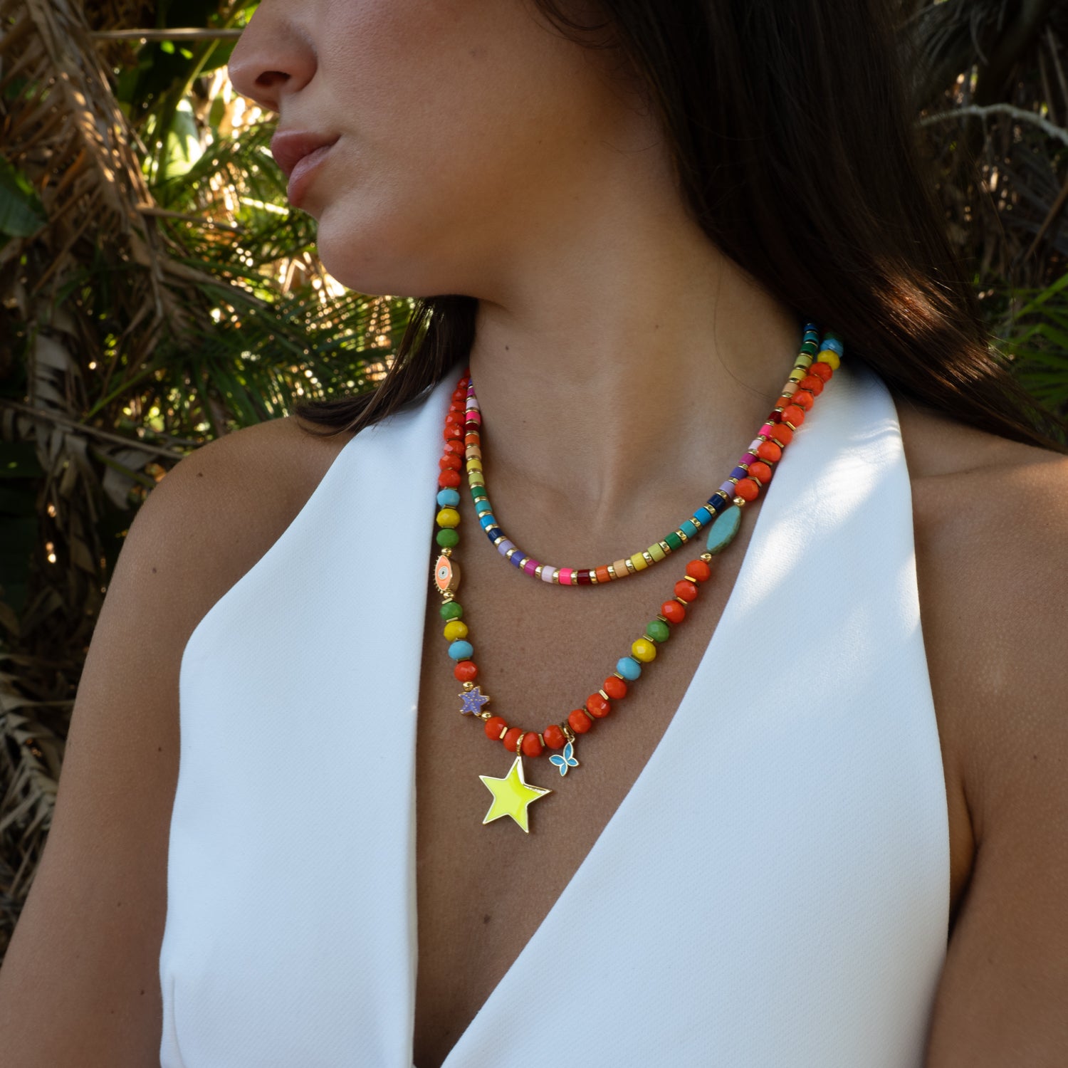 Colorful crystal bead necklace with neon star styled on model, vacation jewelry