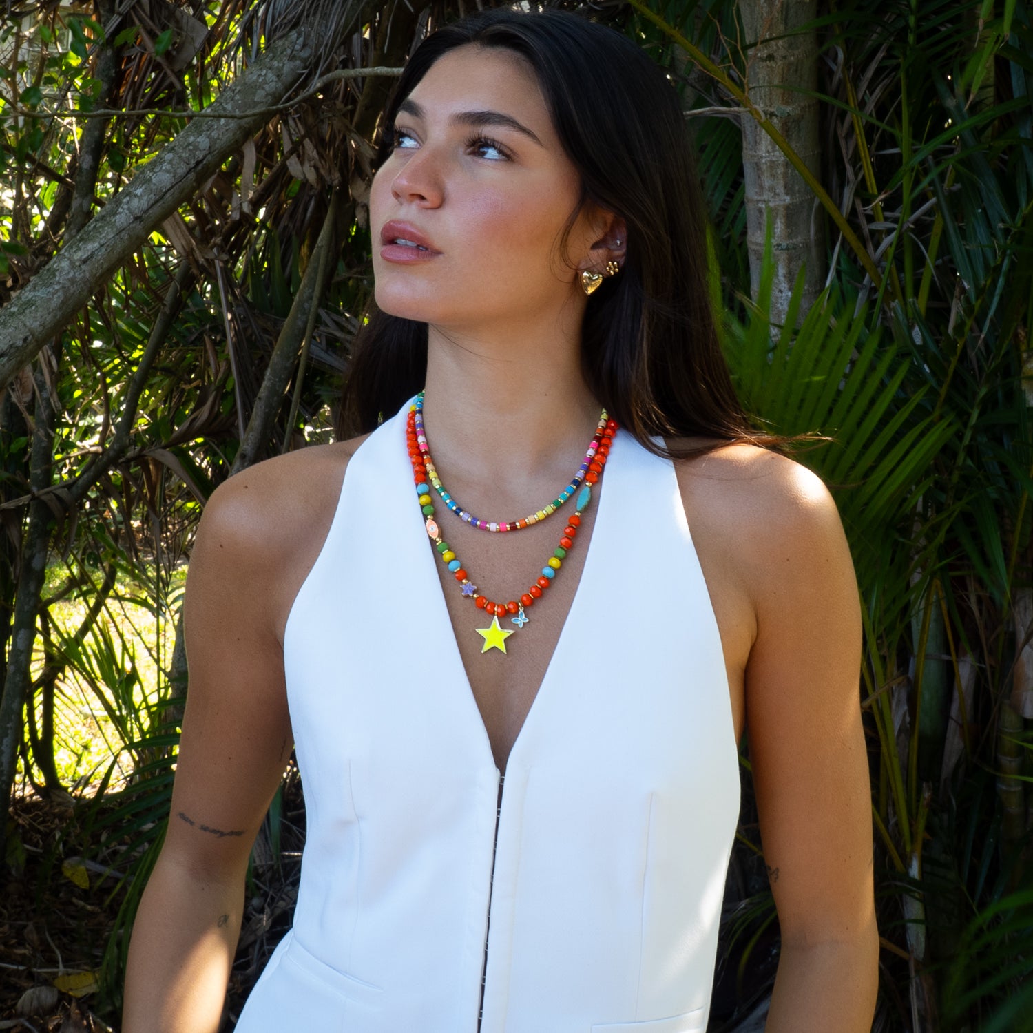 Model wearing Sunshine Star colorful beaded necklace layered, summer styling by Ebru Jewelry