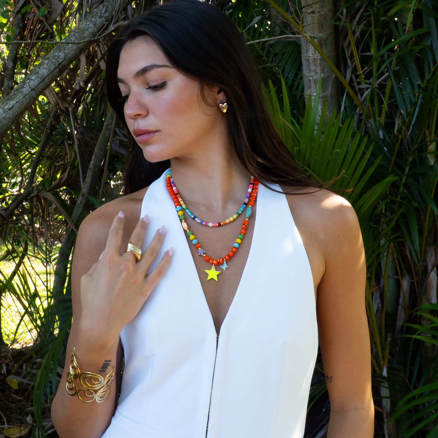 Colorful crystal bead necklace with neon star styled on model, vacation jewelry