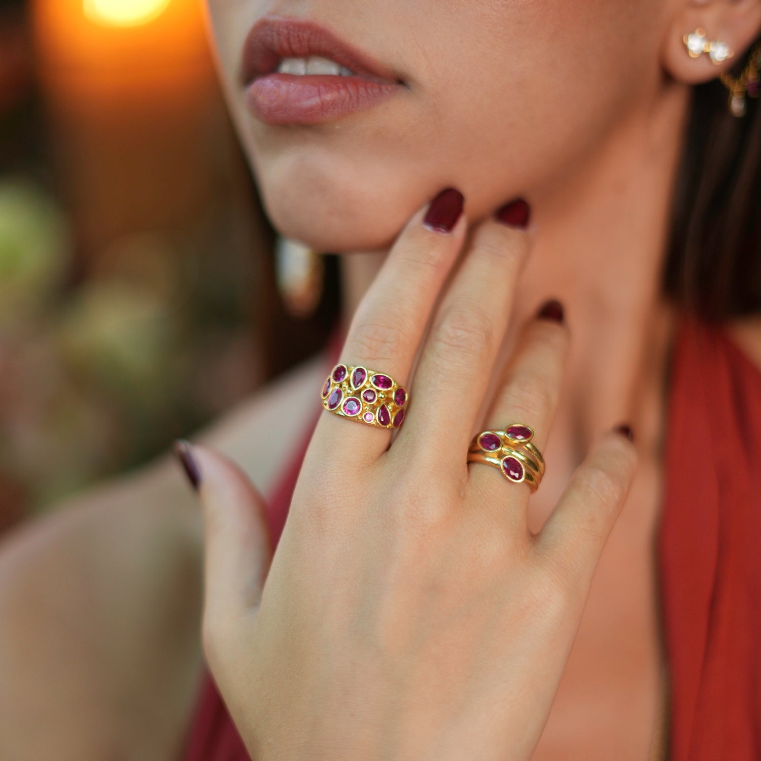 Refined adjustable ring with teardrop ruby stones set in a 24k gold-plated brass base, combining elegance with everyday practicality.
