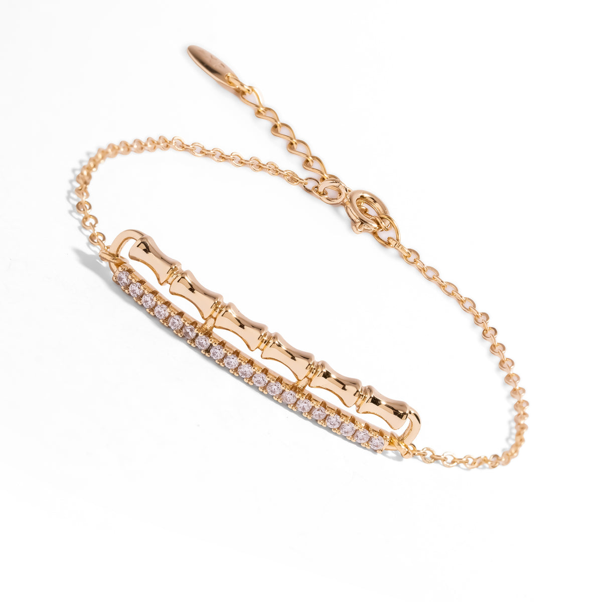 Golden Bamboo pave zircon bracelet at an angle, showing the fine gold cable chain, clasp and extender with an oval tag