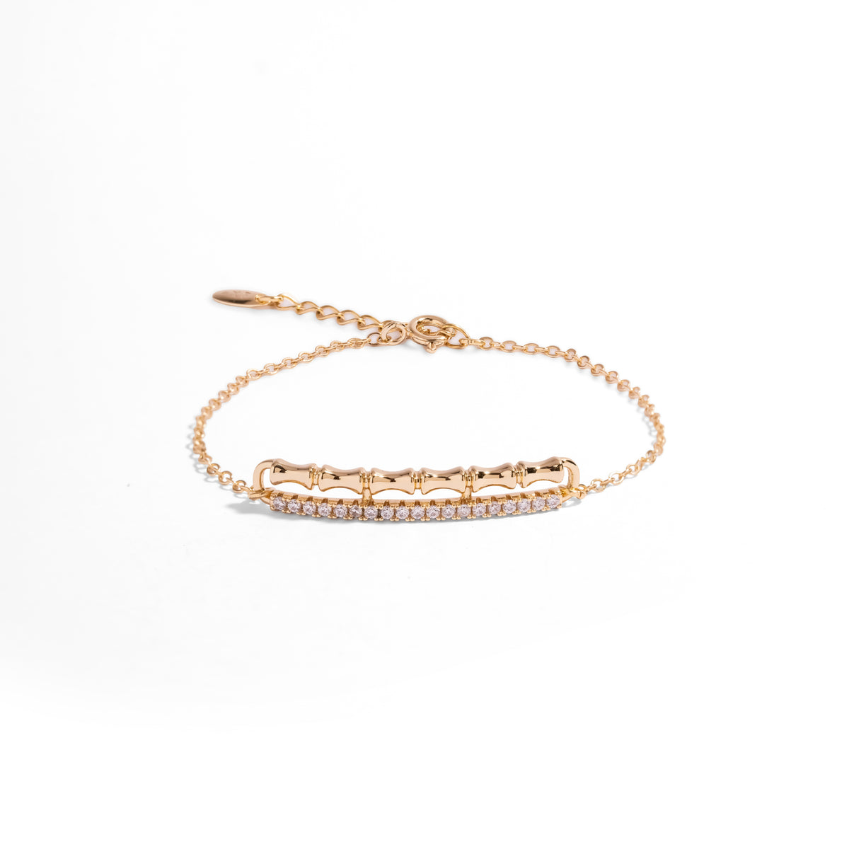 Golden Bamboo minimalist gold chain bracelet on white, slim bamboo bar with a pave white zircon line