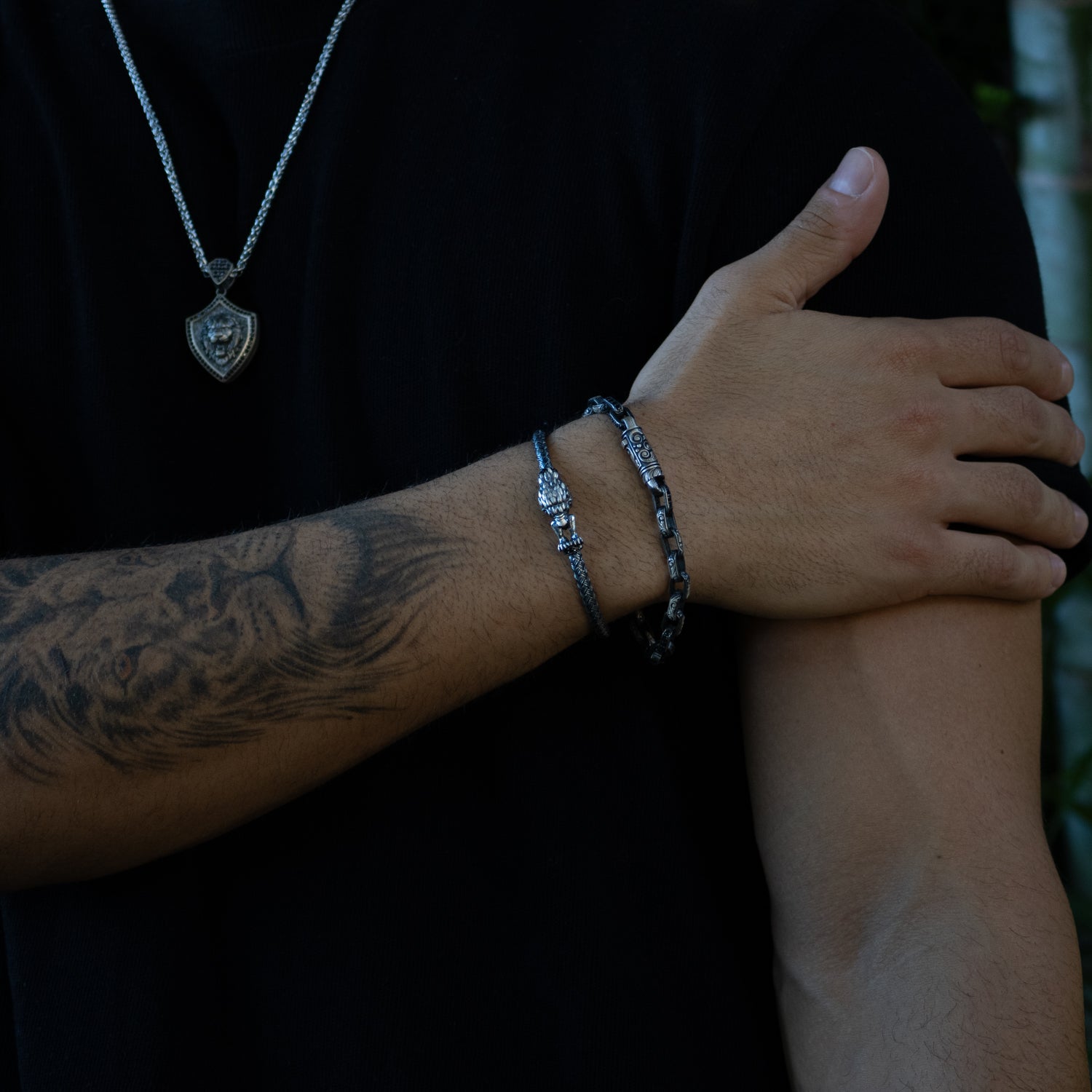 Men’s sterling silver bracelet with tribal engravings and strong chain links.