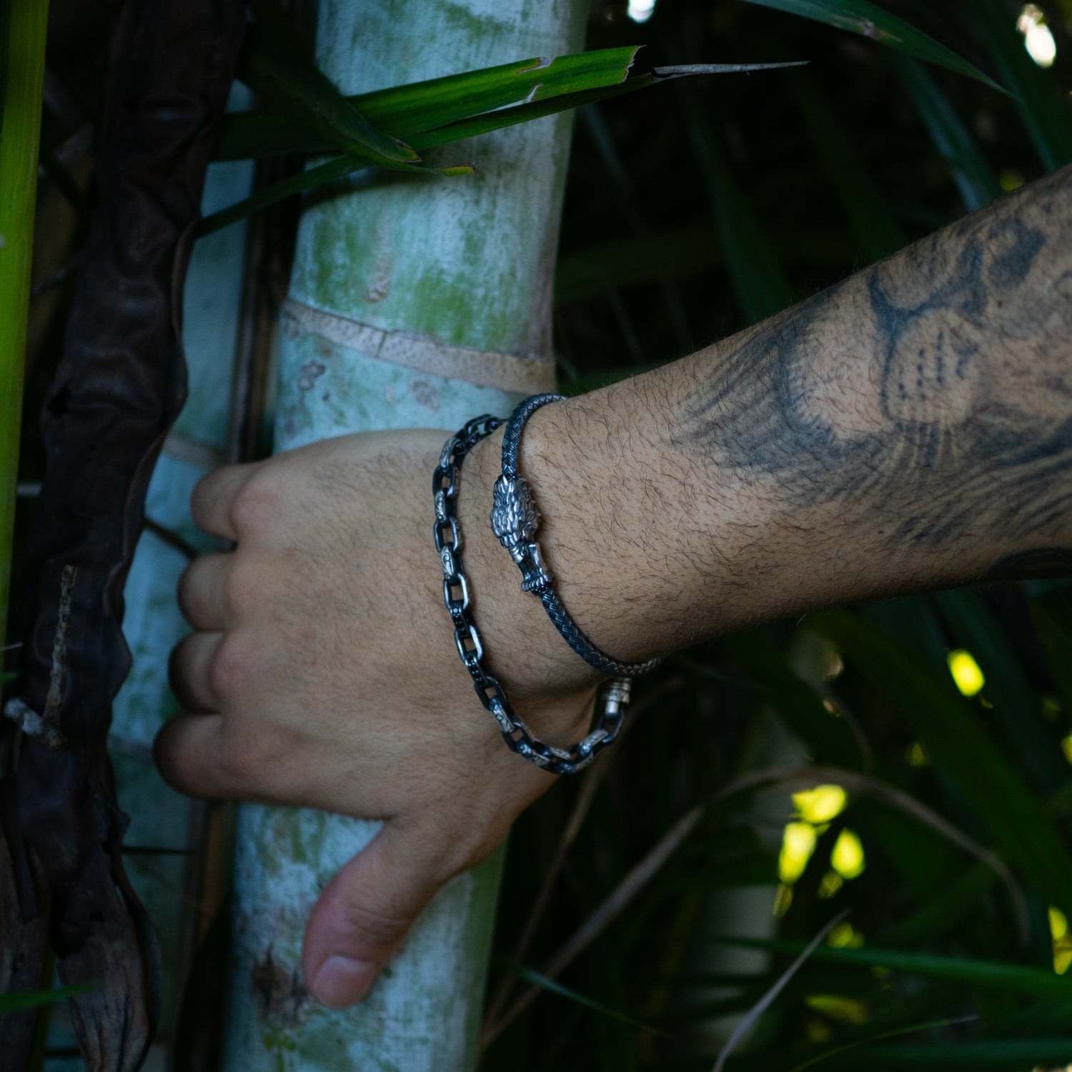 Tribal Force men’s sterling silver bracelet featuring engraved chain links bold
