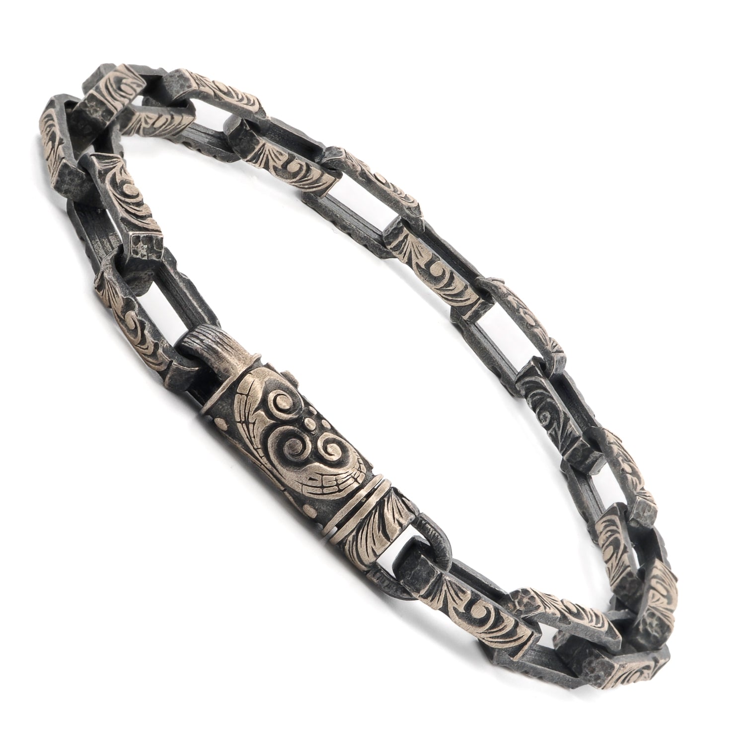 Sterling silver men’s bracelet with tribal patterns and robust chain design.