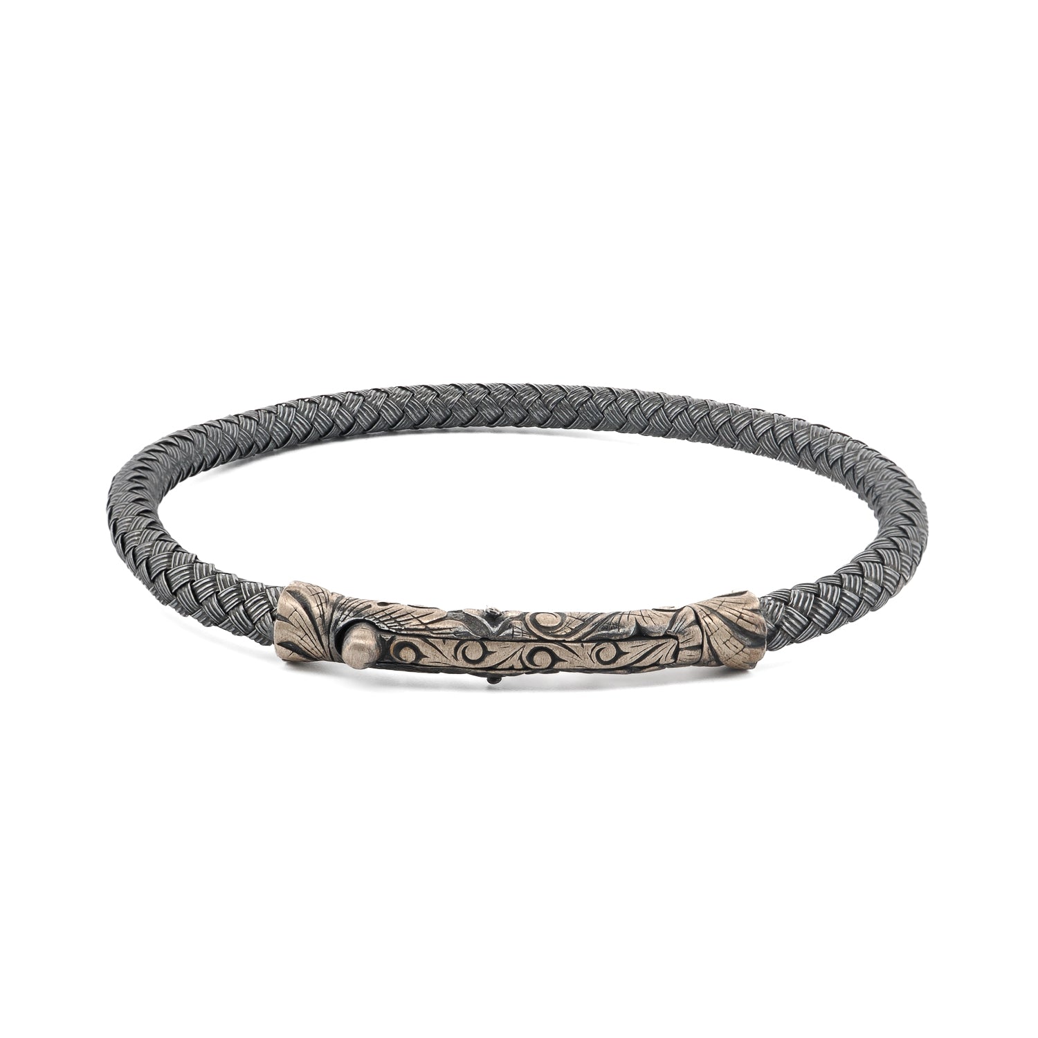 Sterling silver bangle bracelet with tribal engravings, designed for a bold and masculine look.