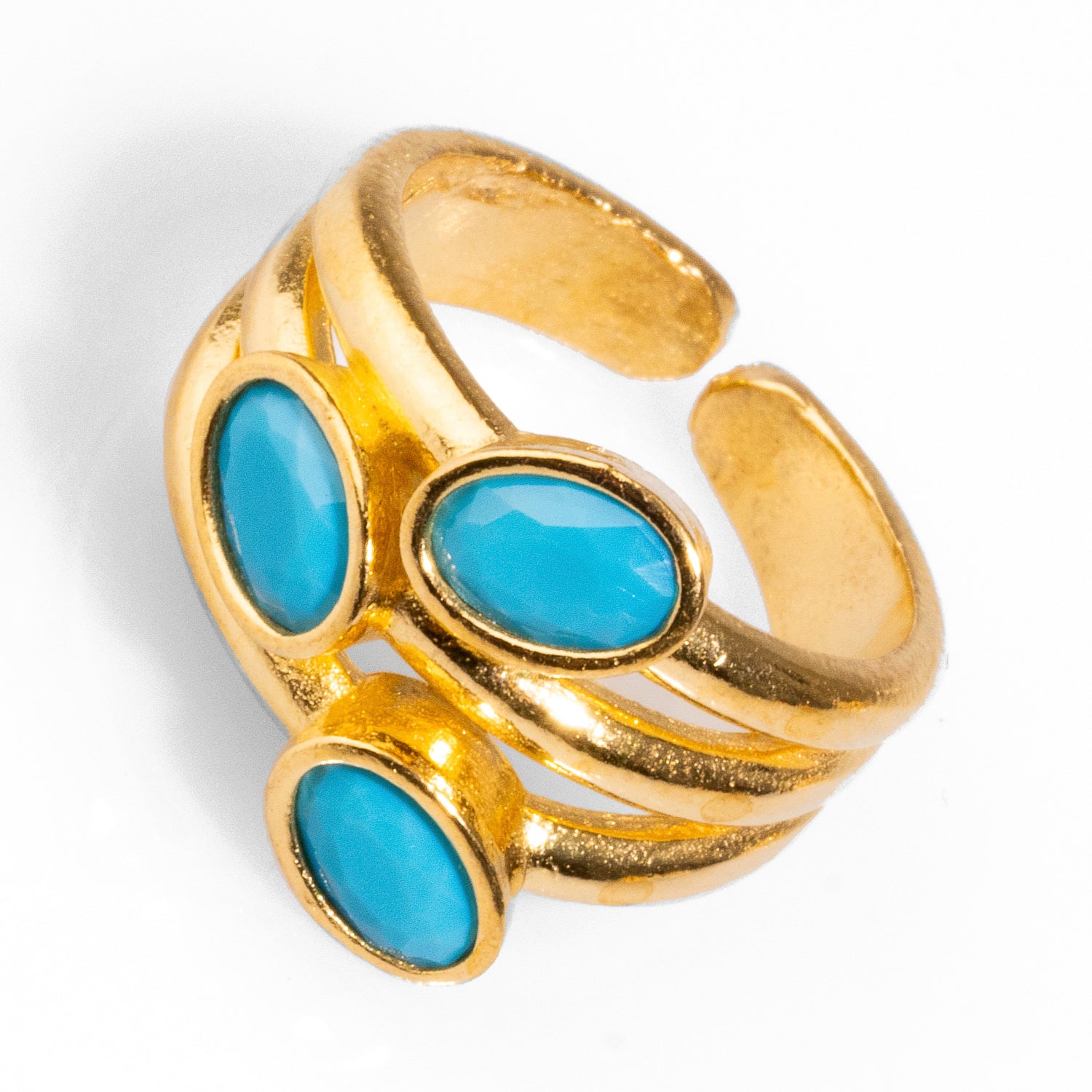 Stylish cocktail ring with three turquoise gemstones set in 24k gold-plated brass, perfect for elevating casual or formal looks.
