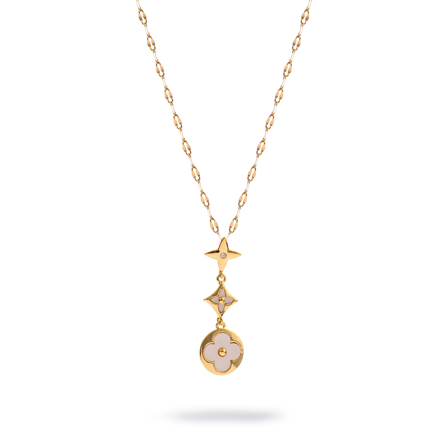 Gold necklace with star, starburst, and blossom charms