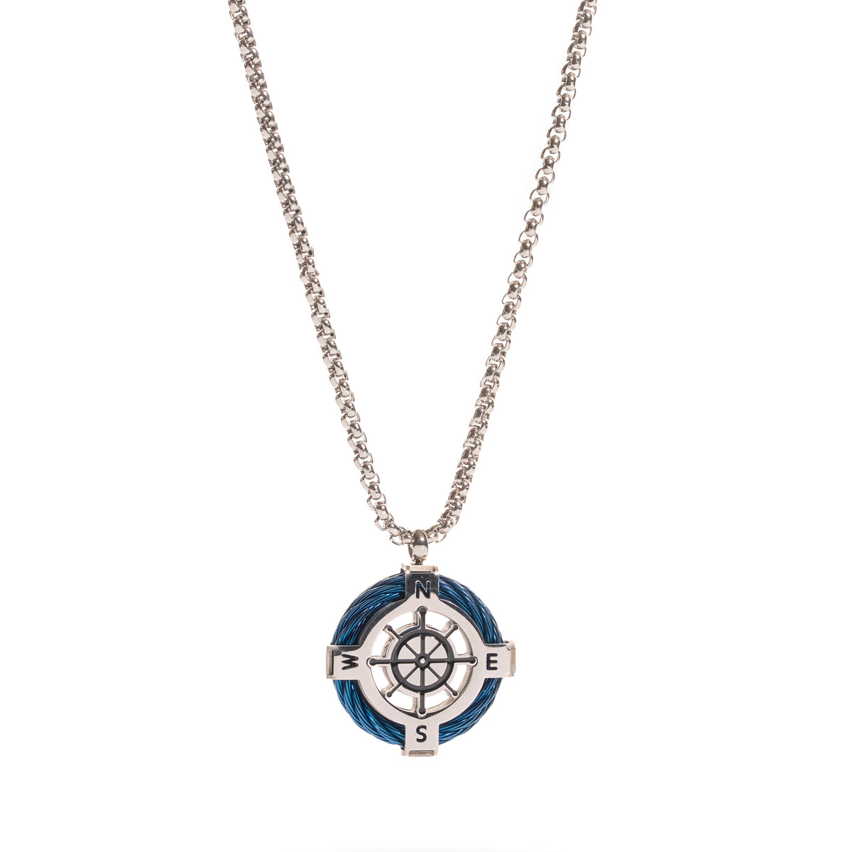 Close up of the compass medallion with N, E, S, W lettering and a steel ship wheel centre