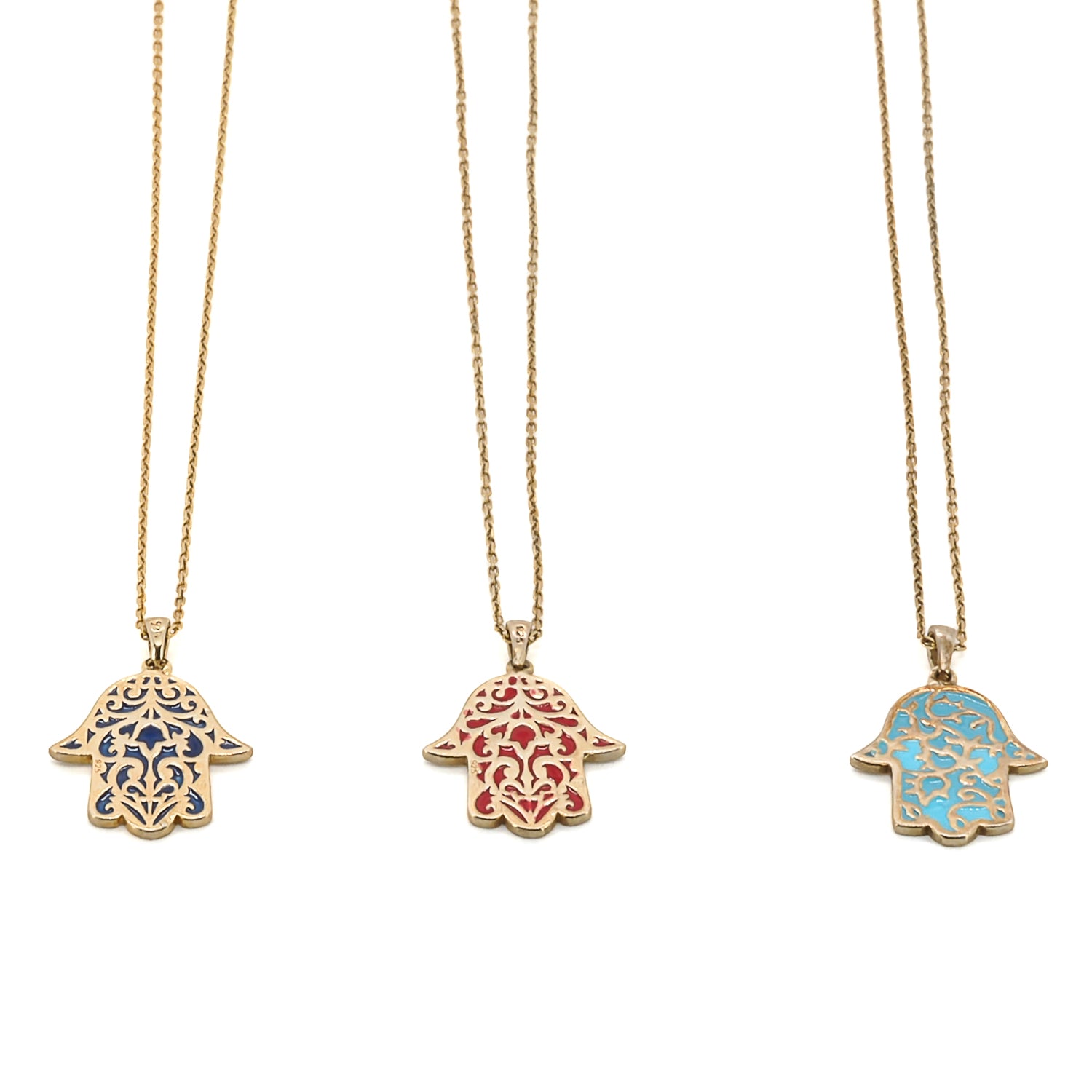 Embrace the positive energy and spiritual significance of the Stay Positive Hamsa Necklace, featuring a stunning hamsa pendant made of sterling silver and 18K gold plating with enamel accents.