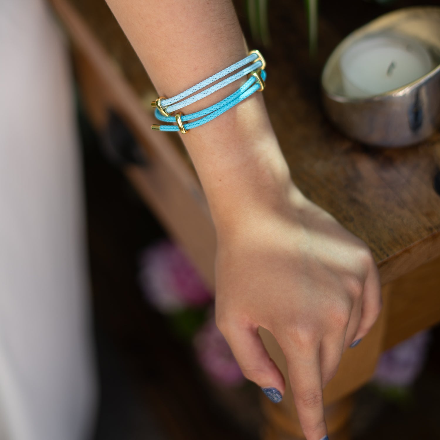 Adjustable braided rope bracelet in turquoise with gold hardware