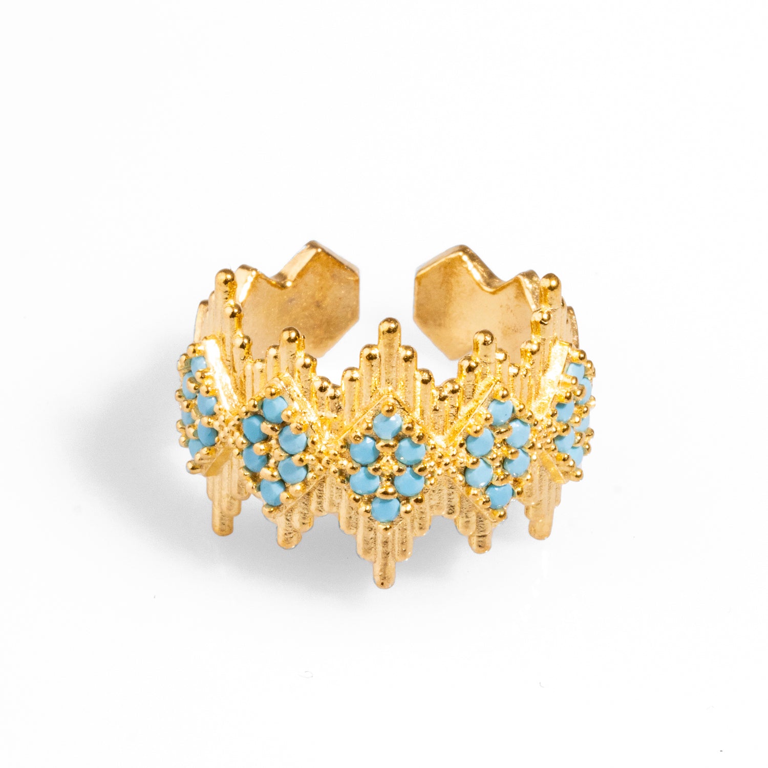 Luxurious 24k gold-plated statement ring featuring a crown-like geometric design adorned with turquoise stones, with an adjustable band for comfort.
