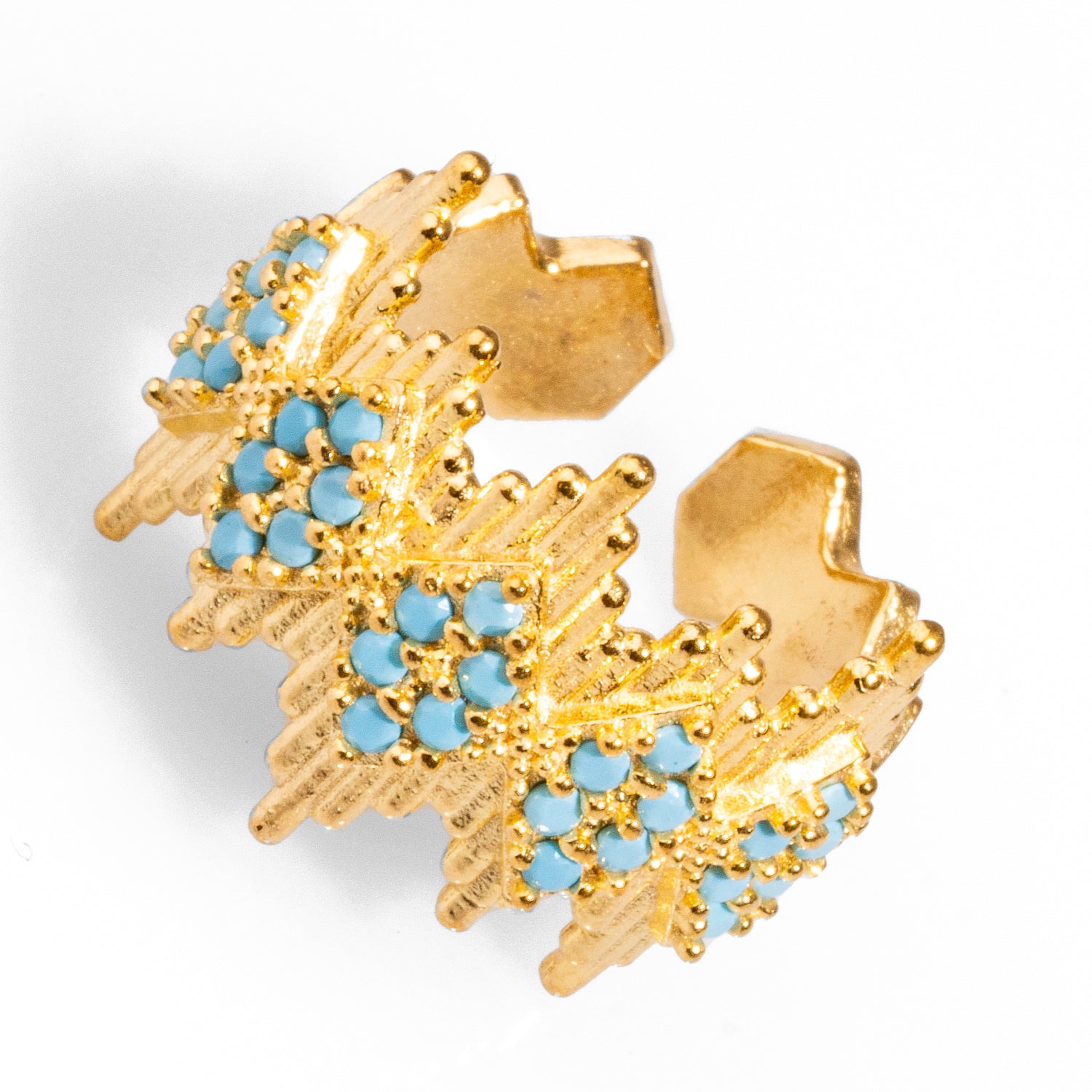 Bold 24k gold-plated statement ring with geometric crown lines and turquoise stones, featuring an adjustable band for a perfect fit.
