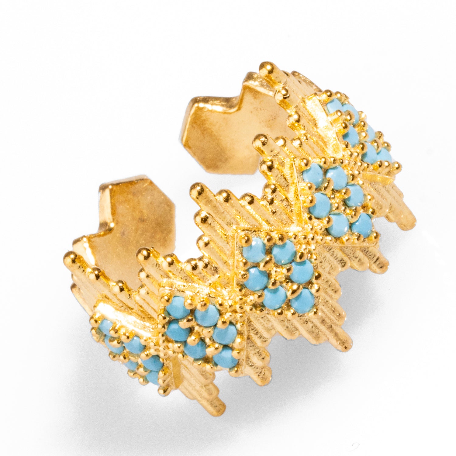 Regal statement ring featuring turquoise stones and a crown-like gold design, crafted from 24k gold-plated brass with an adjustable band.
