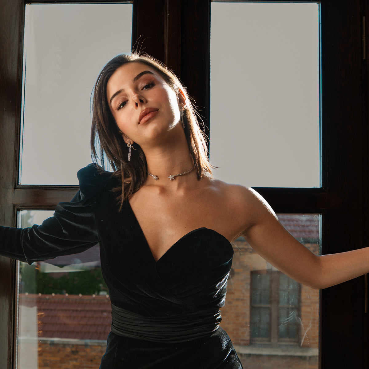 Sterling silver blossom collar necklace worn high on the throat with a black velvet evening dress