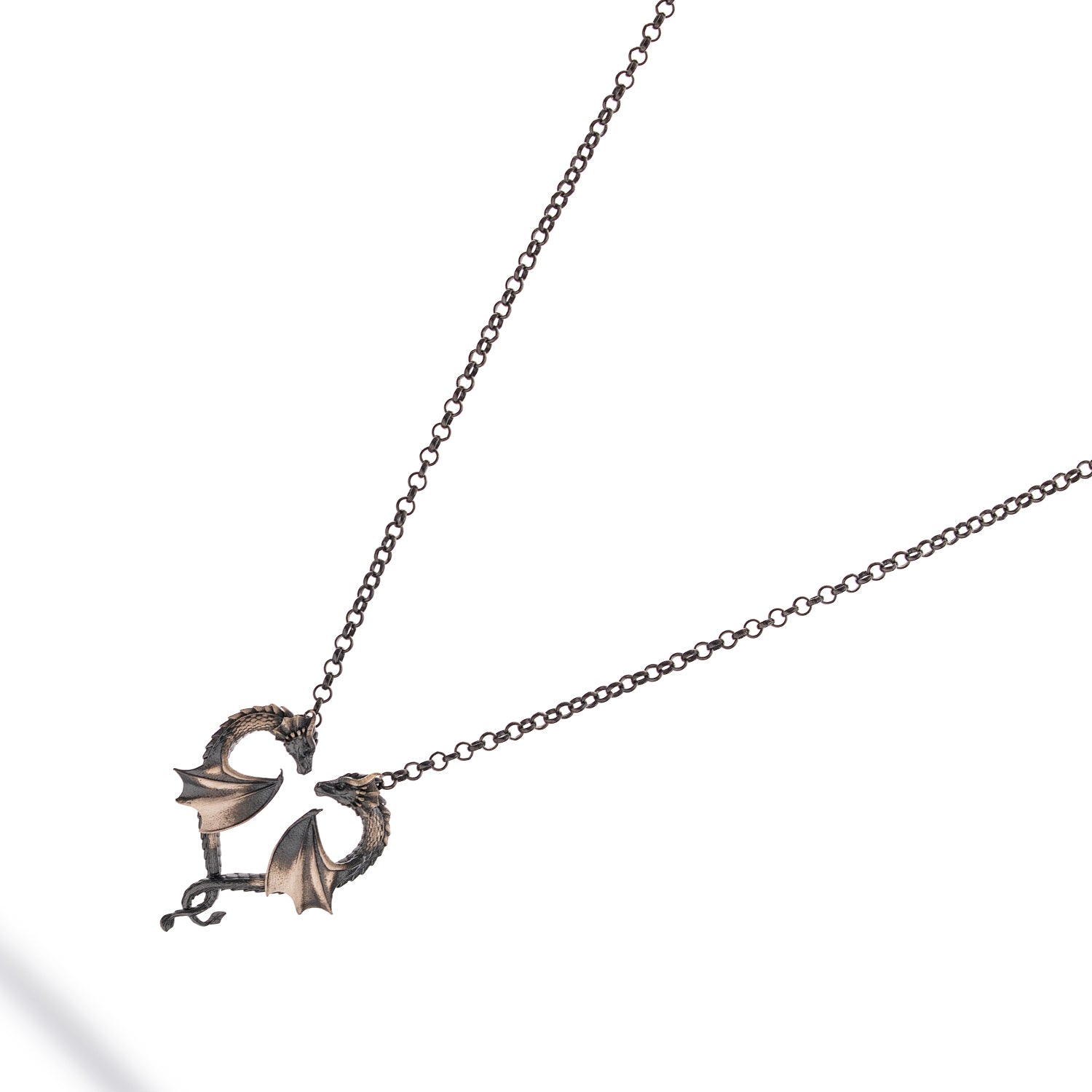 Sterling silver necklace with twin dragons forming a heart pendant, rhodium-plated finish, detailed scales, black accents, bold masculine style.