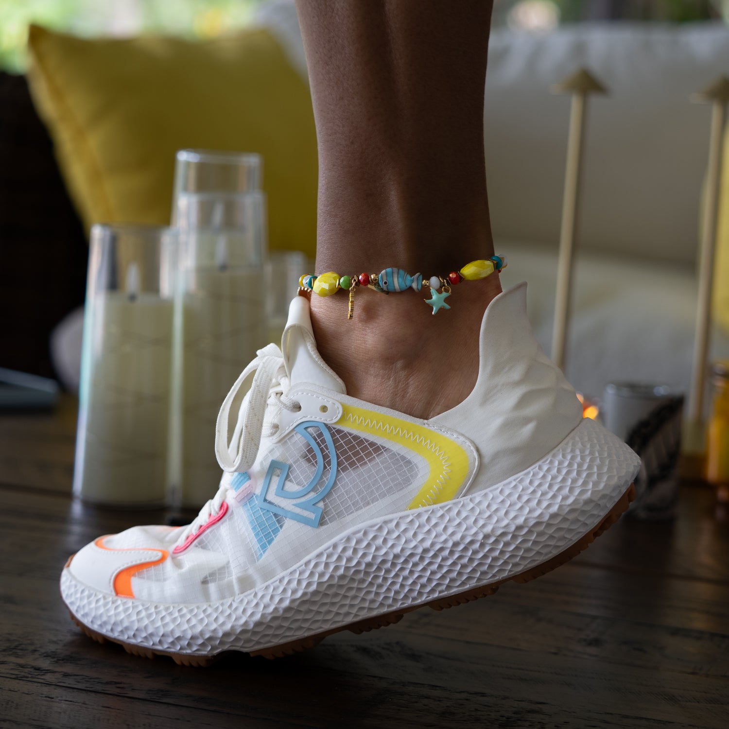 Woman wearing Vacation Vibes Lucky Charms Colorful Anklet with white sneakers and colorful accents — summer beach styling