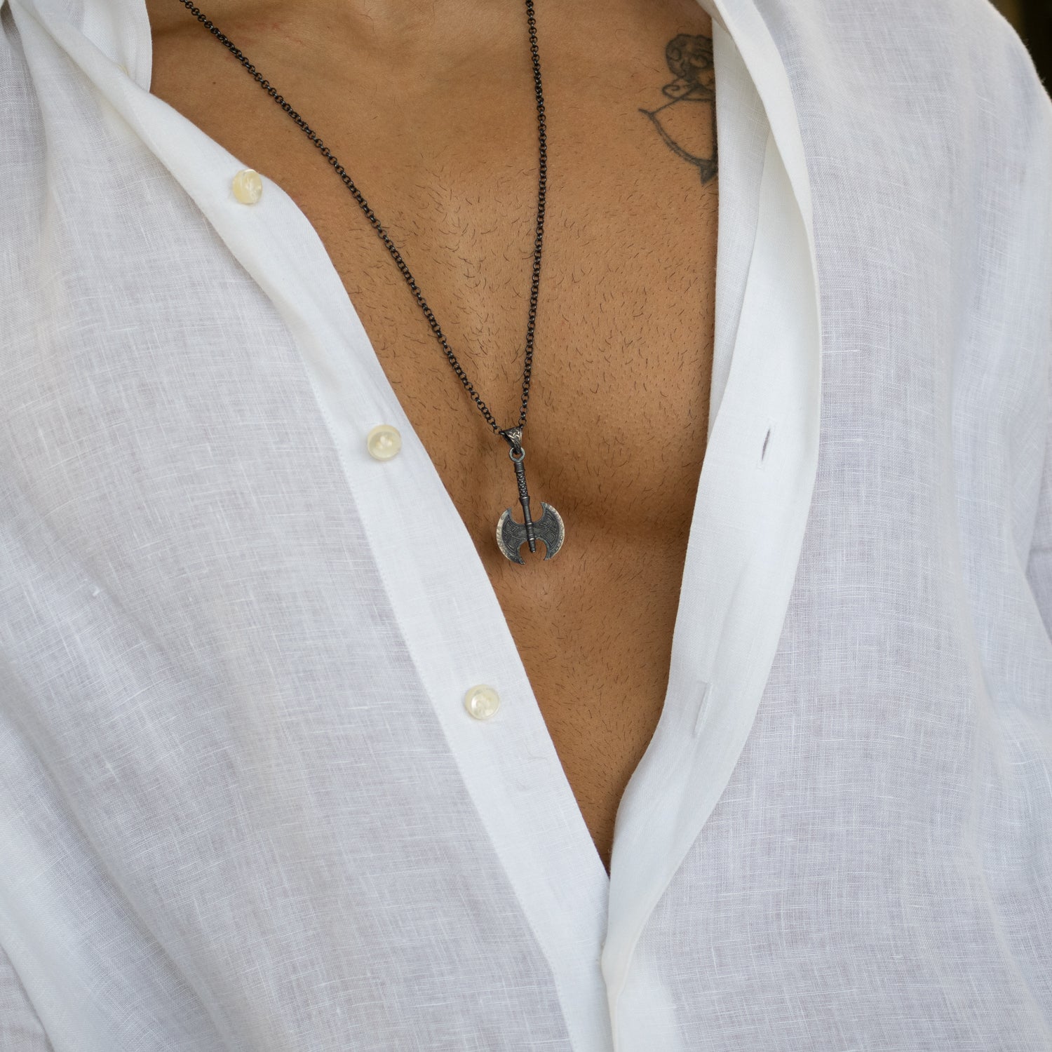 Sterling silver necklace with Viking axe pendant, rhodium finish, intricate engraved design, Norse warrior style symbolizing strength and courage.