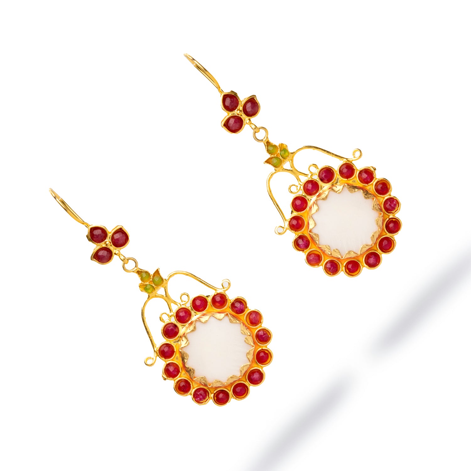 Sophisticated gold dangle earrings with a floral theme, showcasing a central mother of pearl stone and colorful ruby and jade gemstones.
