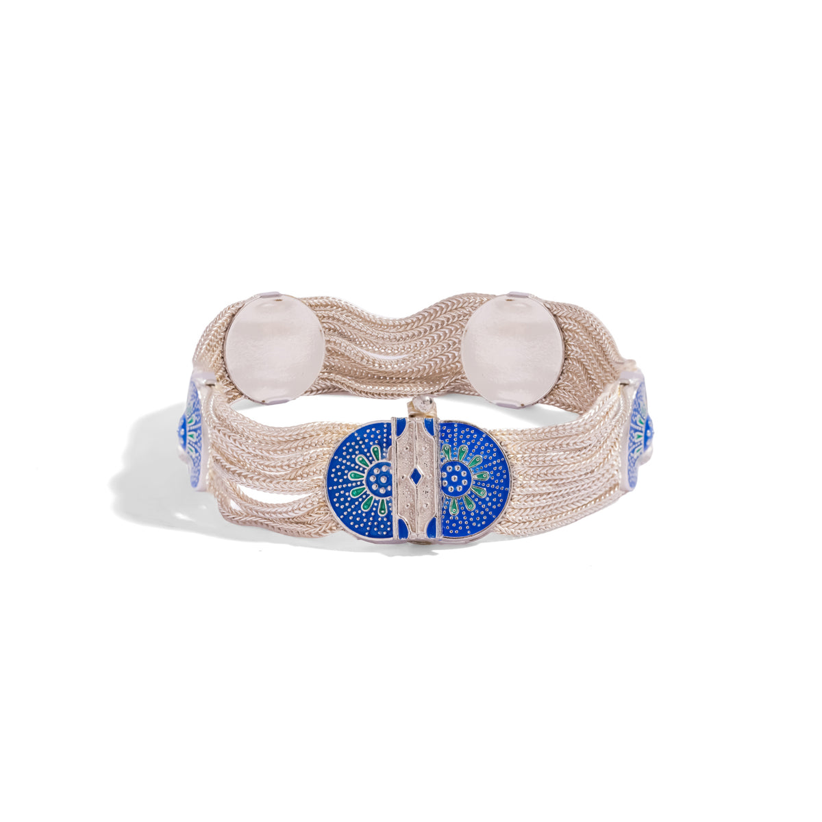 Front view of the wide woven silver bracelet with the enamel medallion clasp at the center